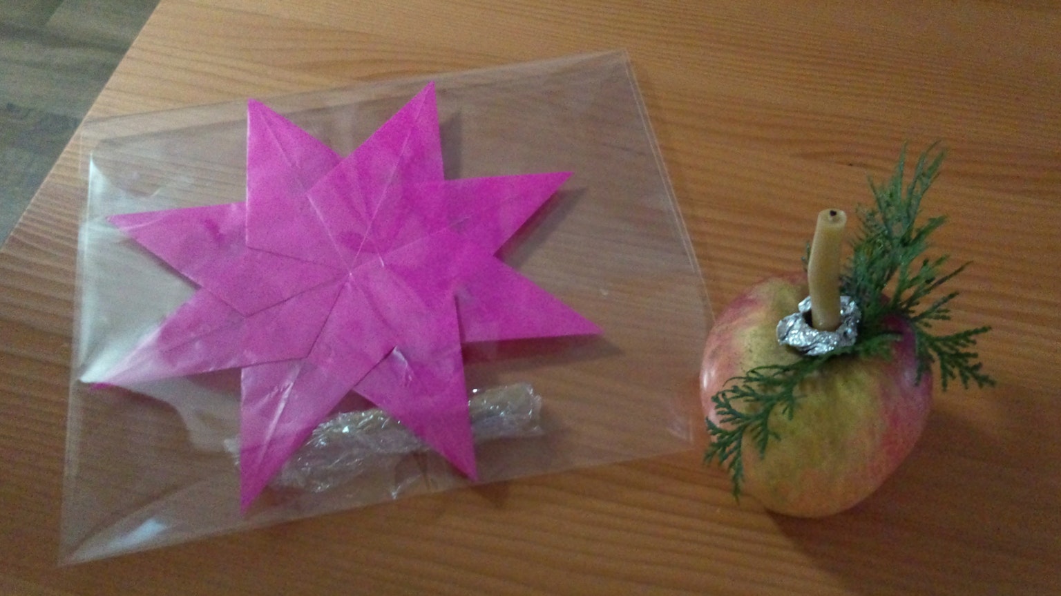 Pink star-shaped decoration and apple arrangement