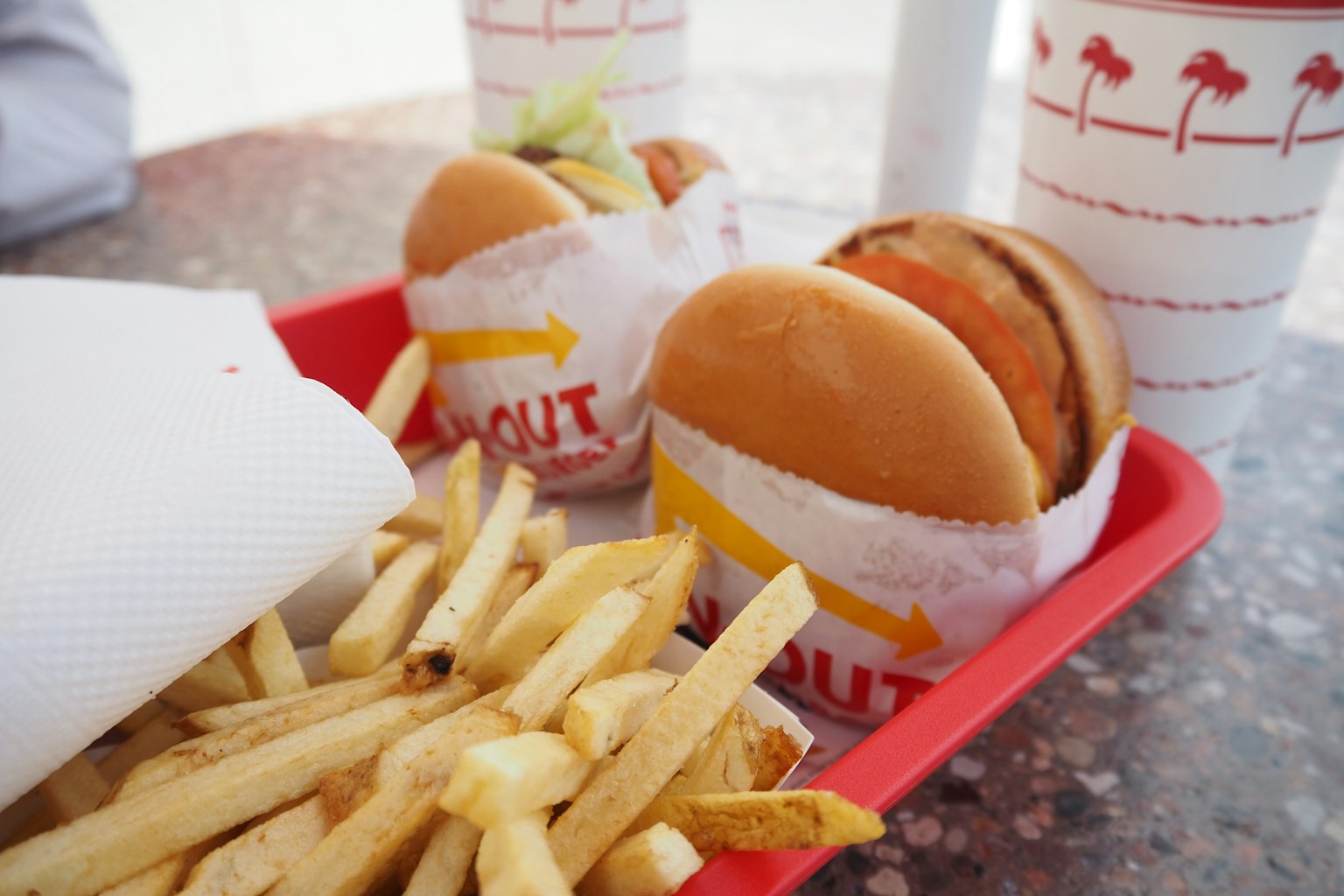 In-N-Out burgers and fries served on a red tray