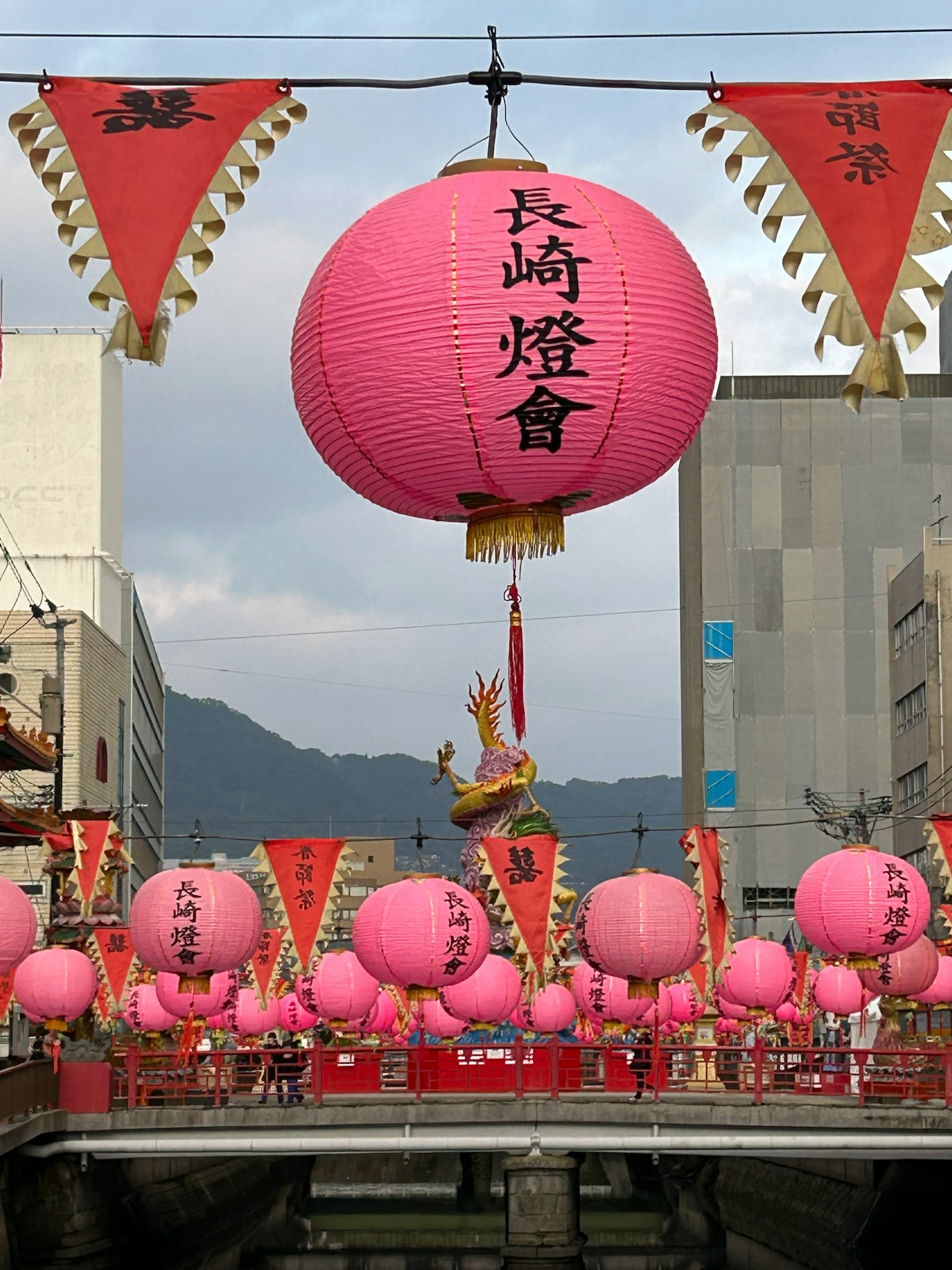 Pink lanterns decorate a bridge during the Nagasaki Lantern Festival