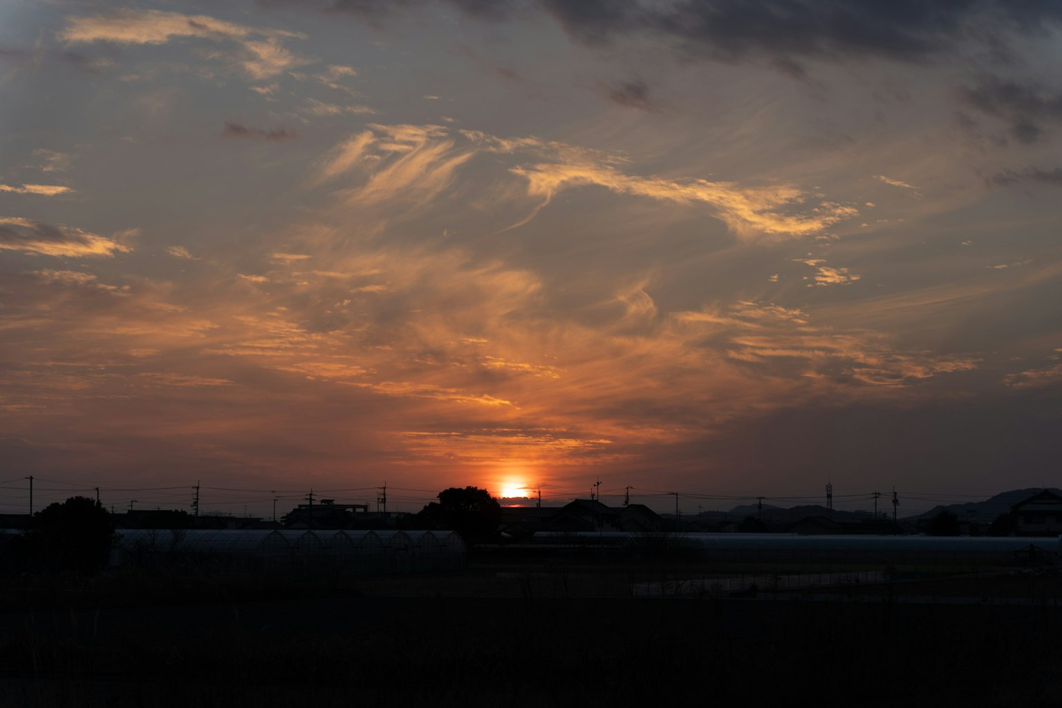 Beautiful sunset landscape with clouds and sun