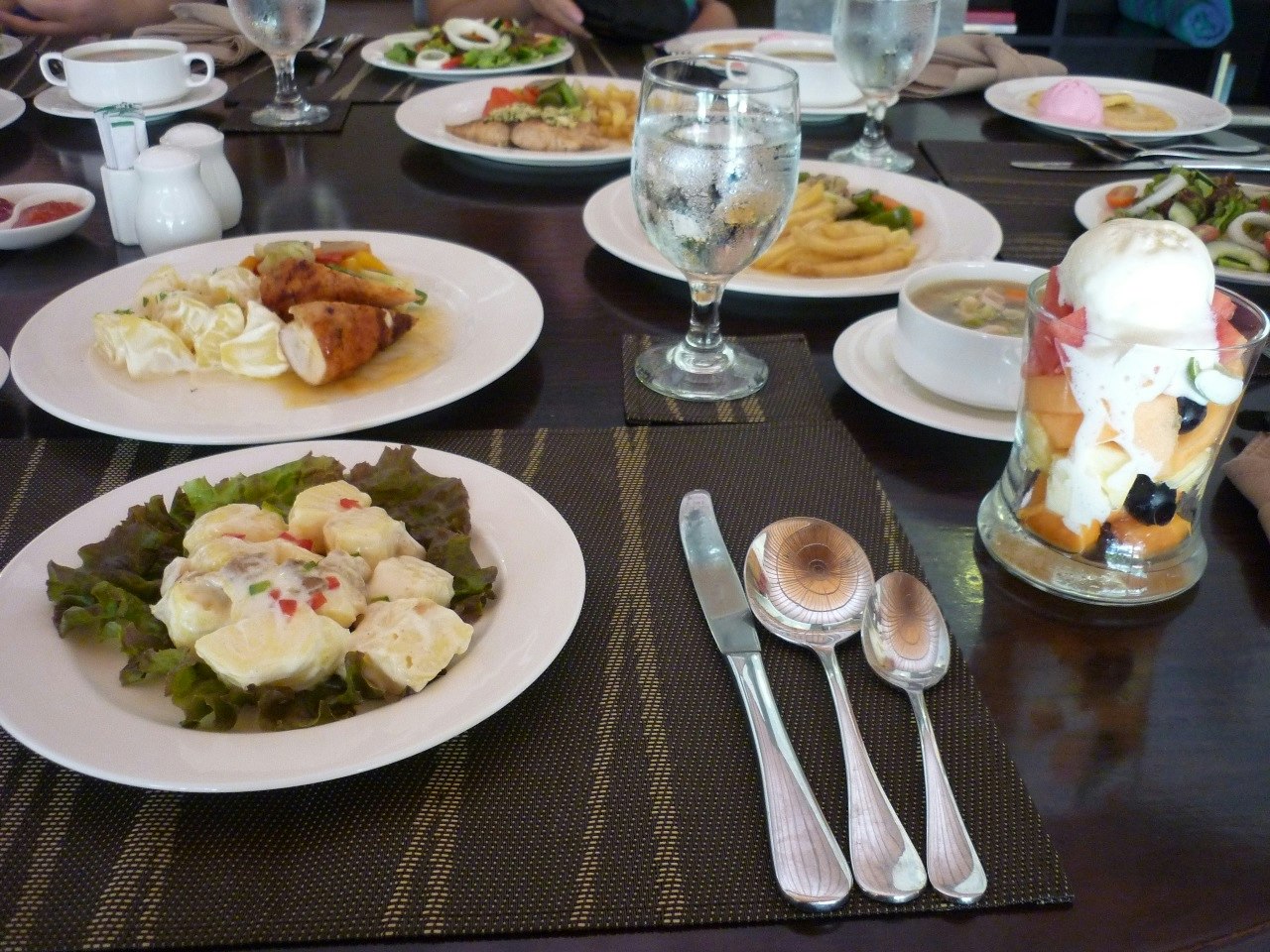 assorted appetizers and desserts on a dining table