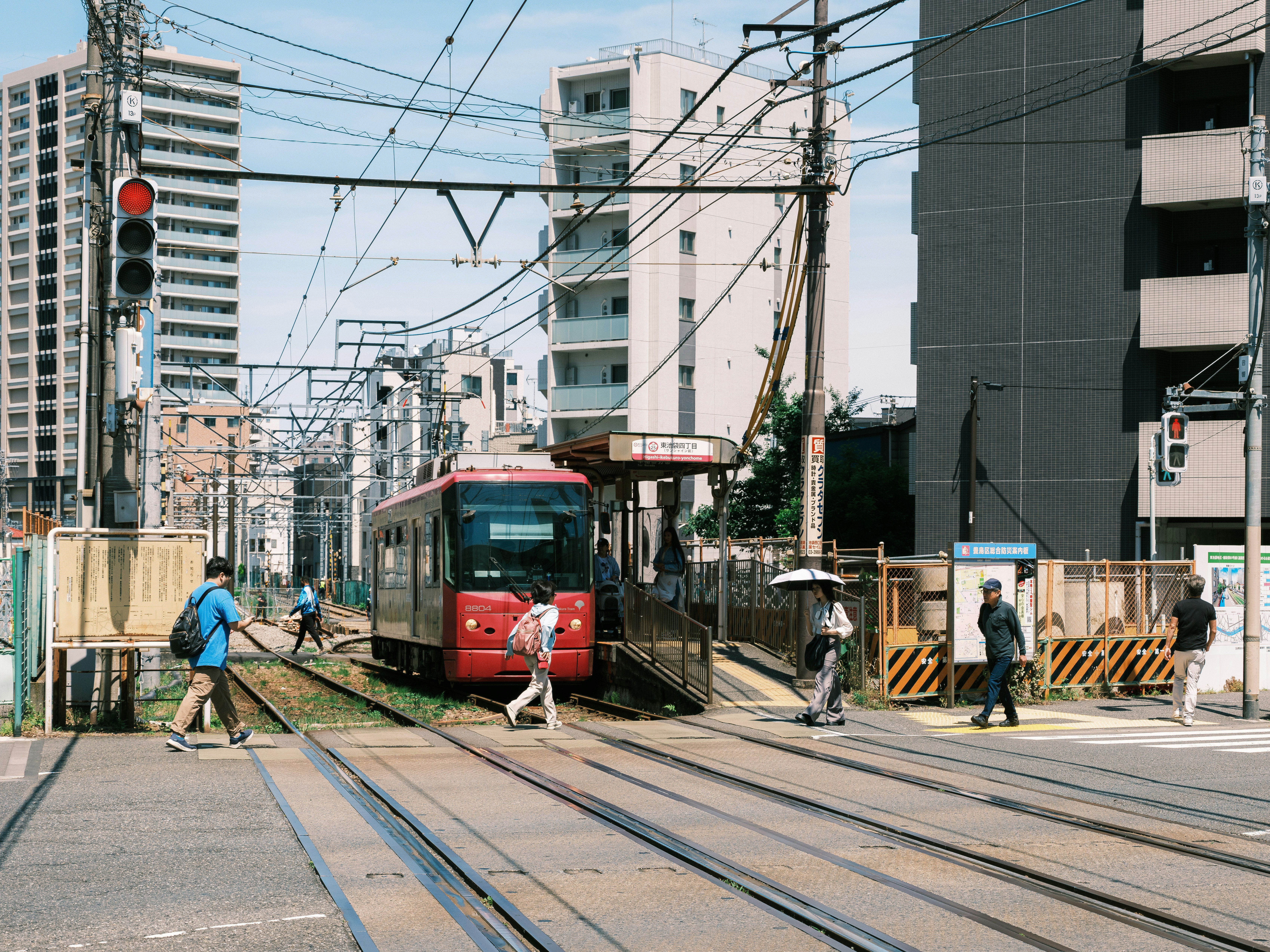 Urban level crossing with a tram on the tracks