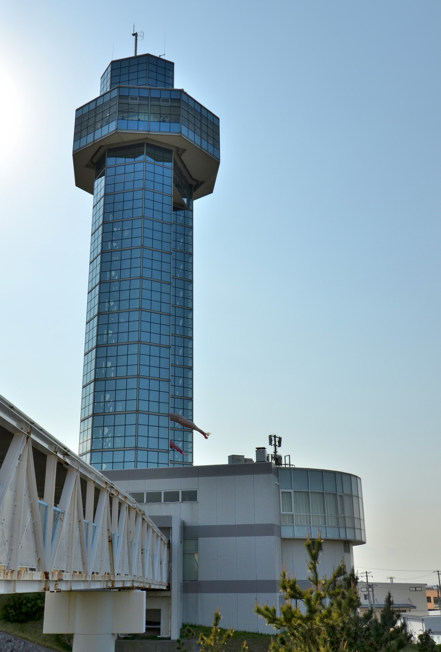 Glass tower structure with clear blue sky