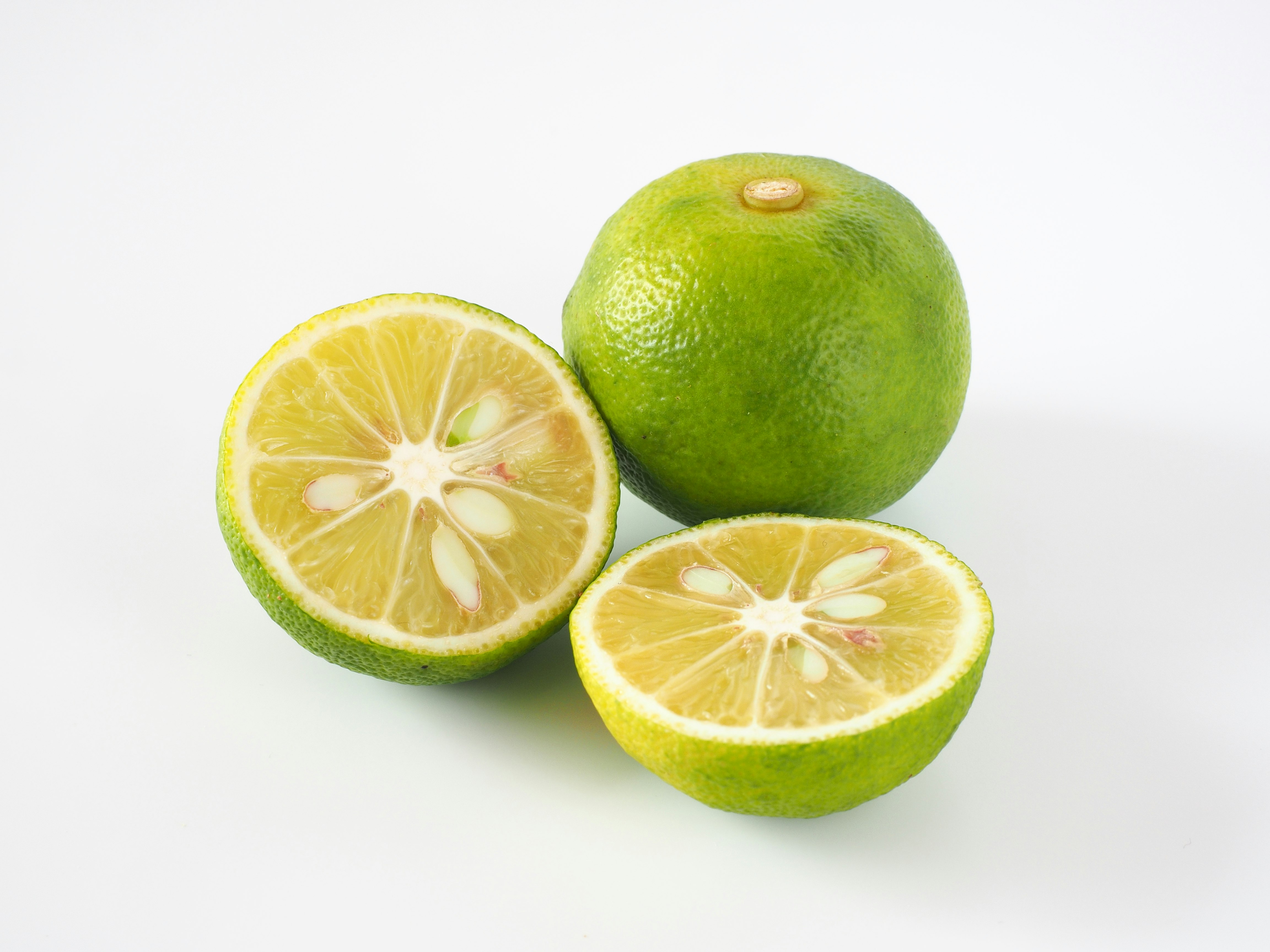 Lime and lemon fruits on a white background