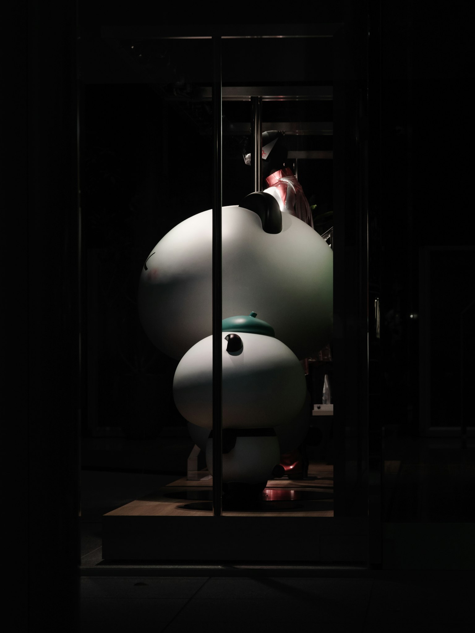 White spherical objects arranged in a dark setting