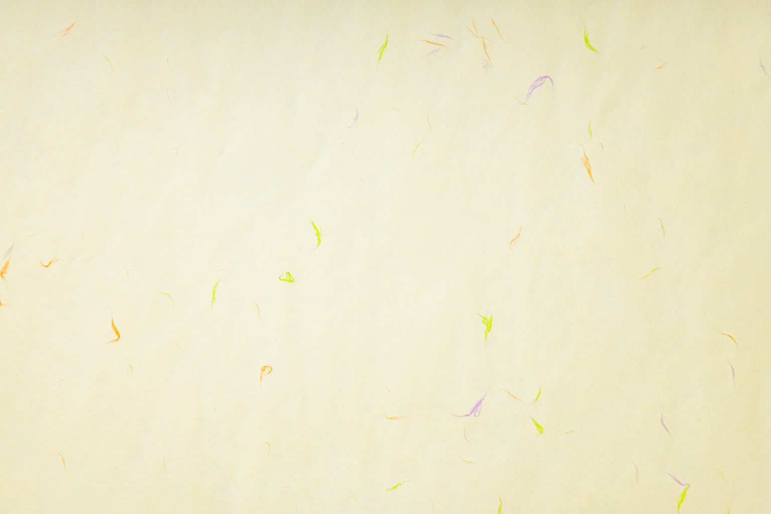 Light cream-colored background with scattered colorful speckles