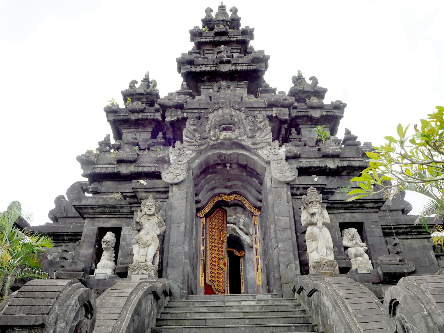 Grand stone facade and intricate carvings of a traditional Balinese temple