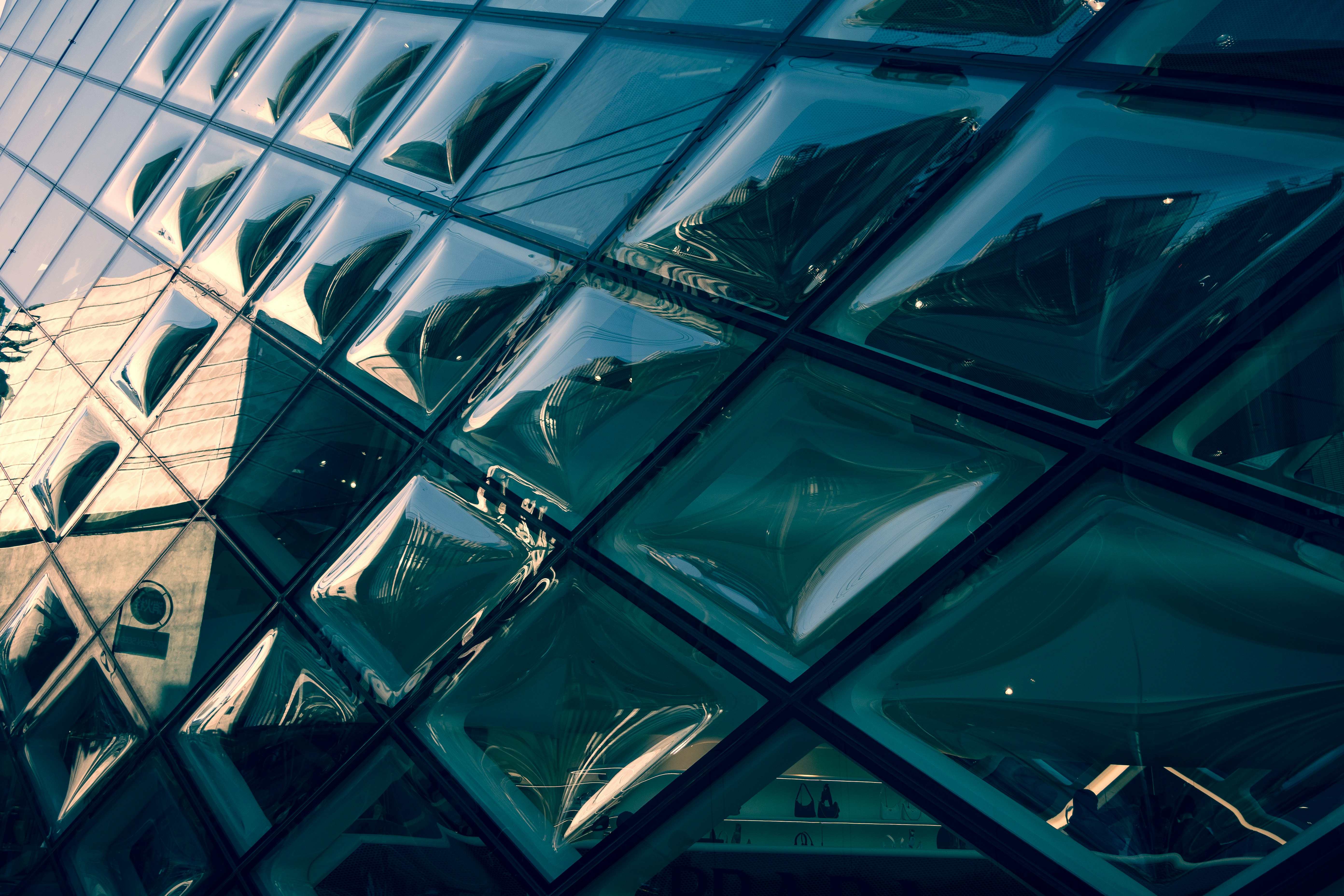 Geometric view of a glass building with reflections