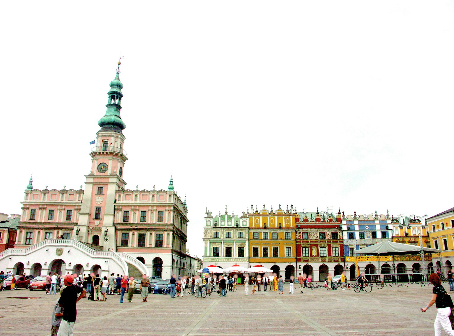 Vibrant square with colorful buildings and a tall tower