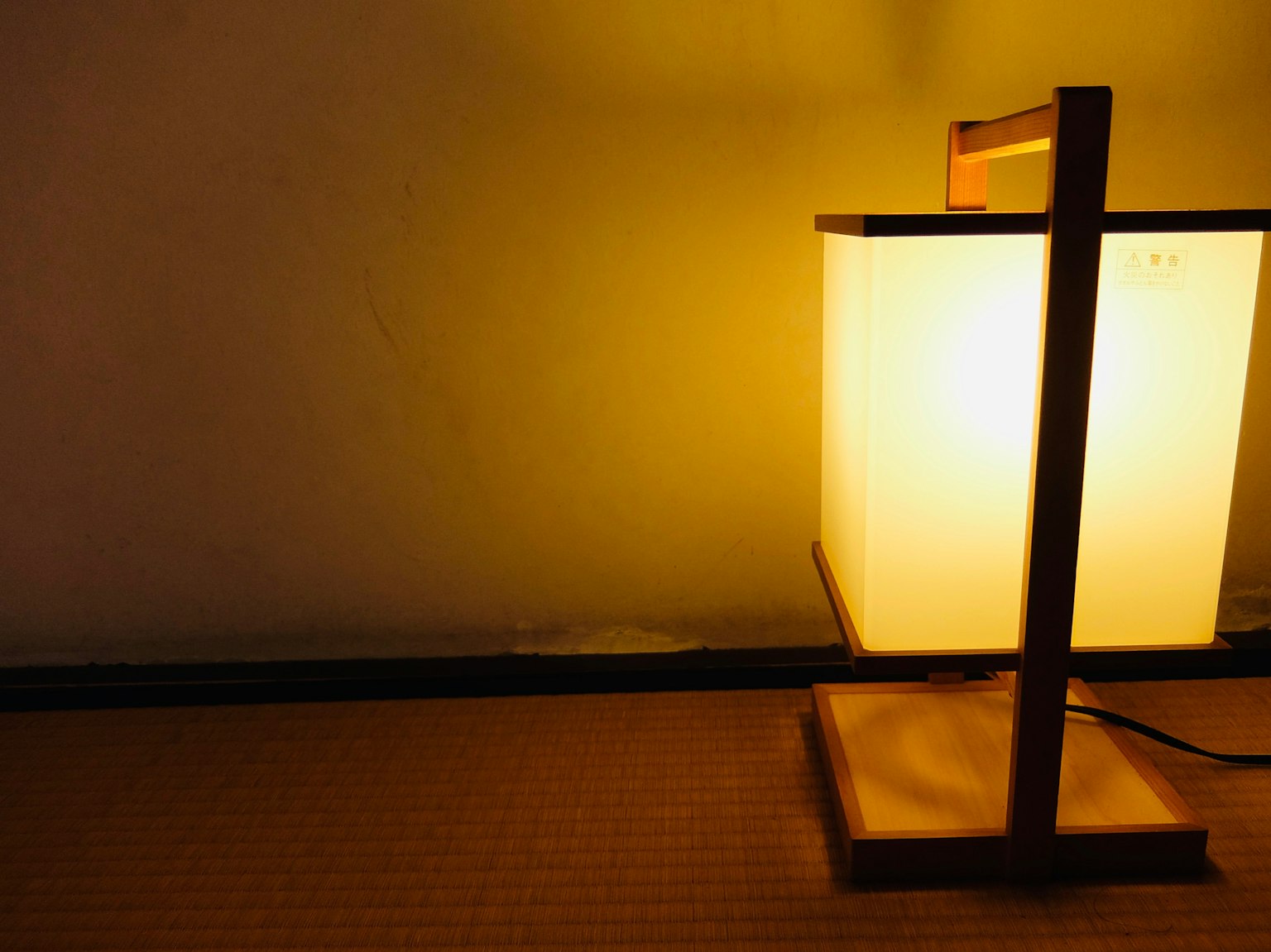 Wooden stand lamp with a soft glowing light