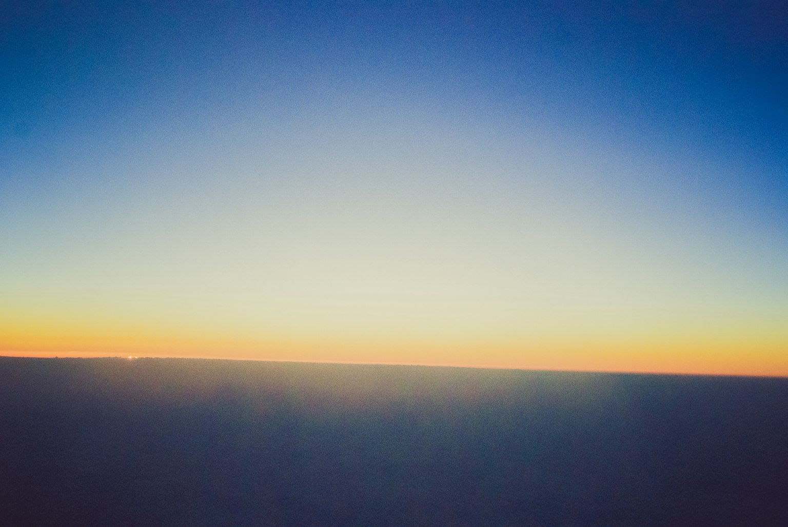 Beautiful sunset landscape with gradient from blue to orange in the sky