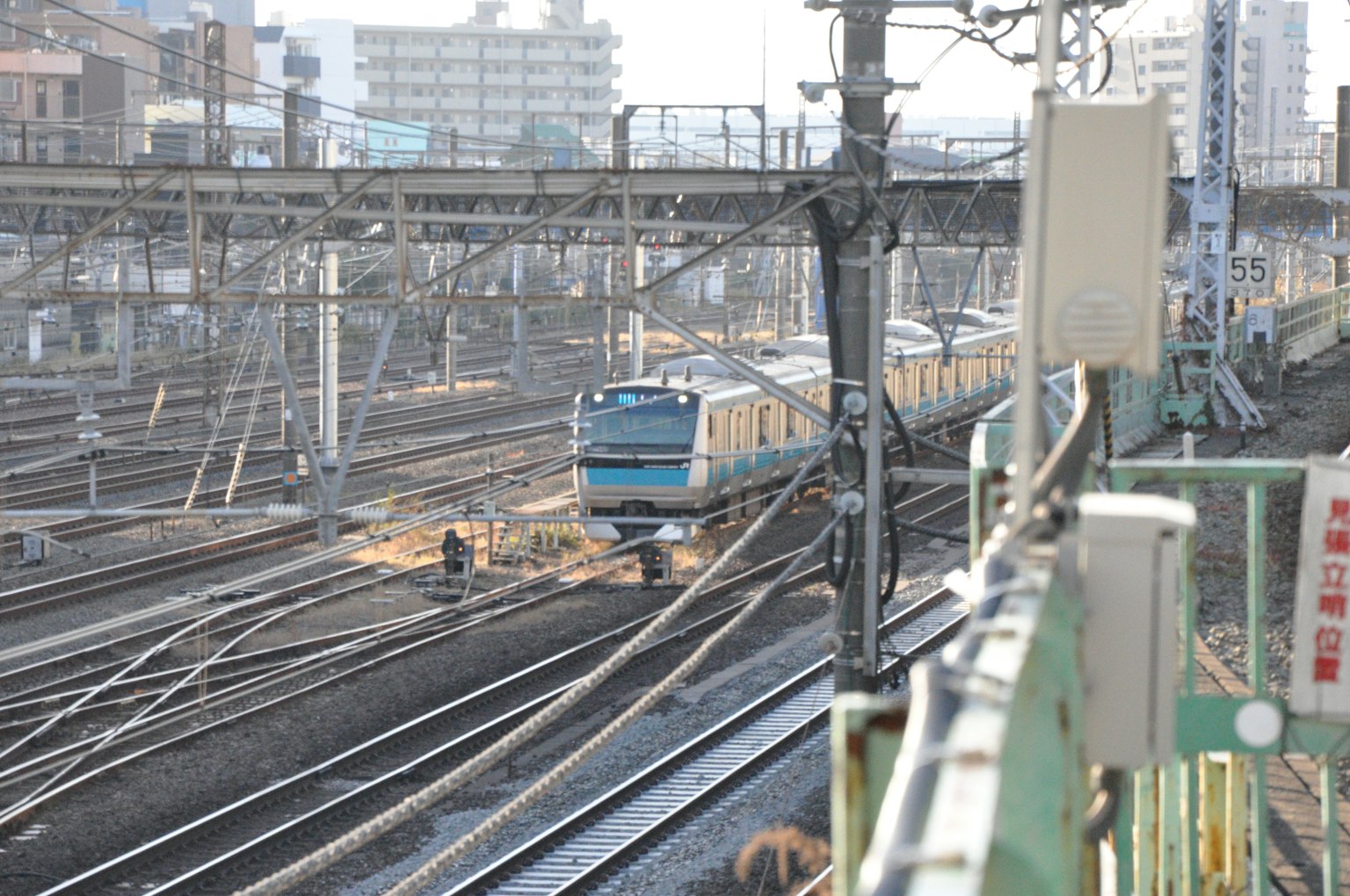 View of railway tracks with a train in motion