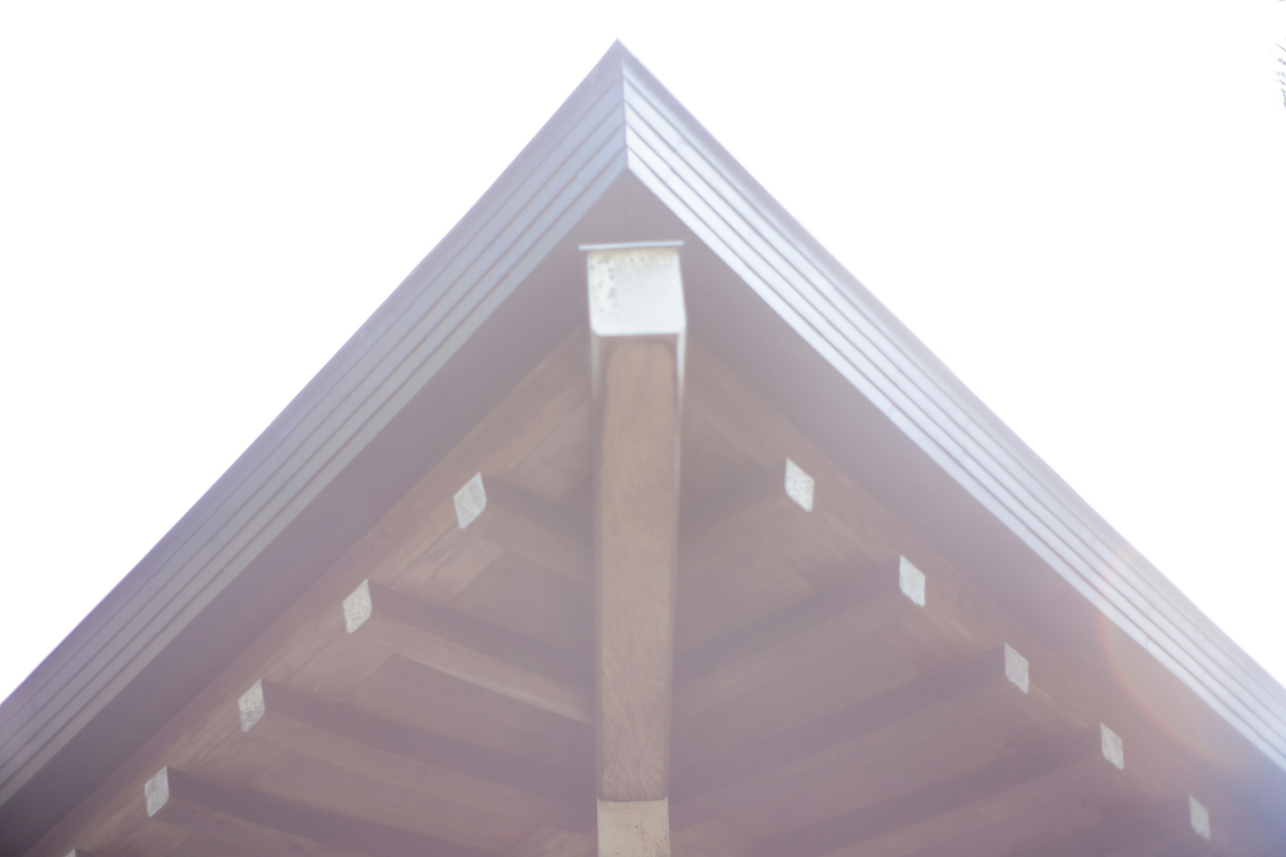 upper exterior of a white triangular-roof building