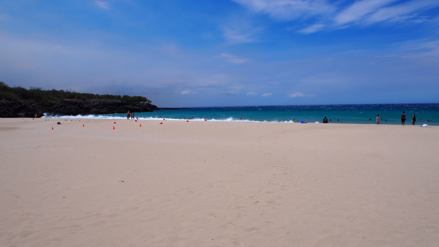 Beach scene with blue ocean and white sandy shore