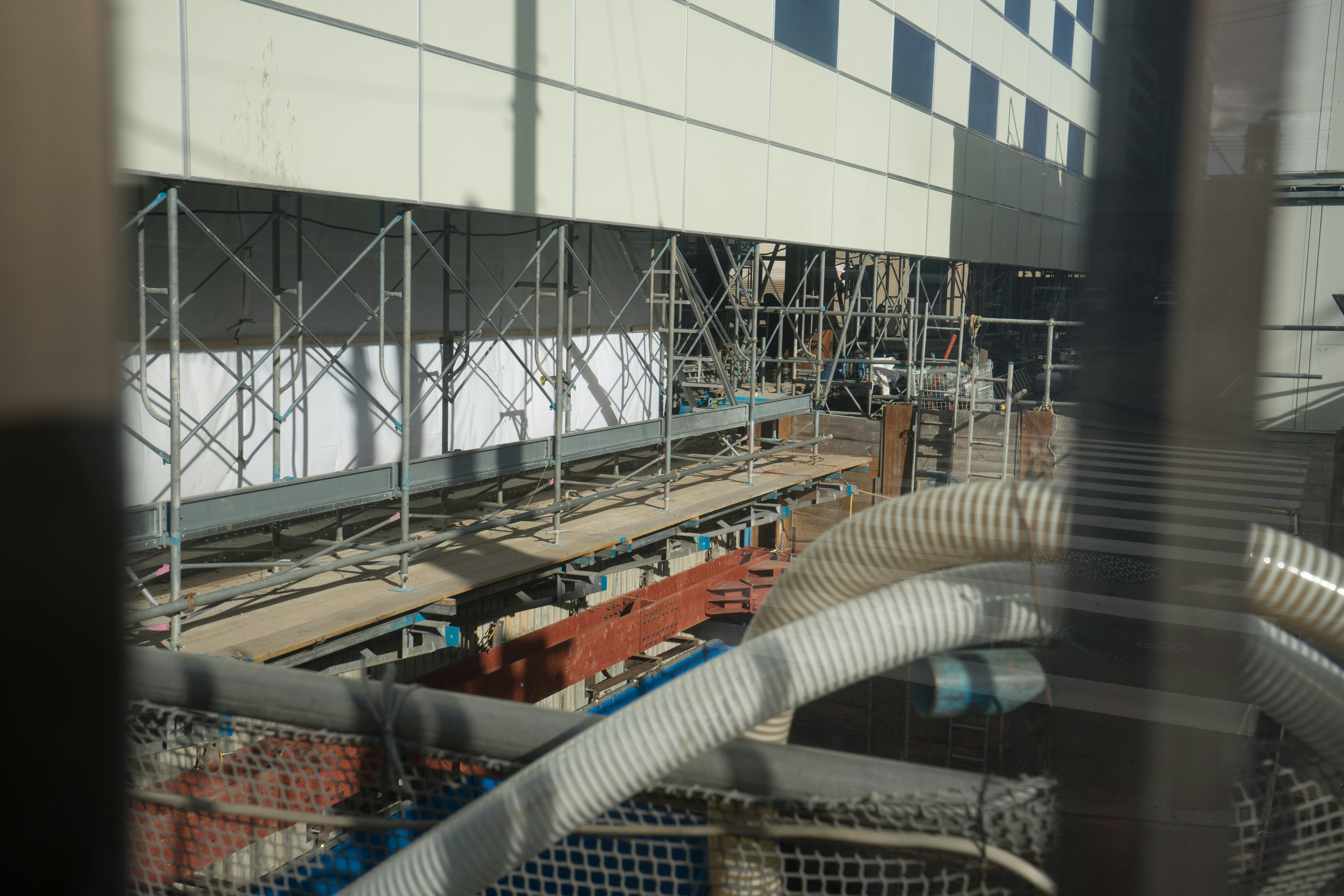 View of a building renovation with scaffolding and equipment