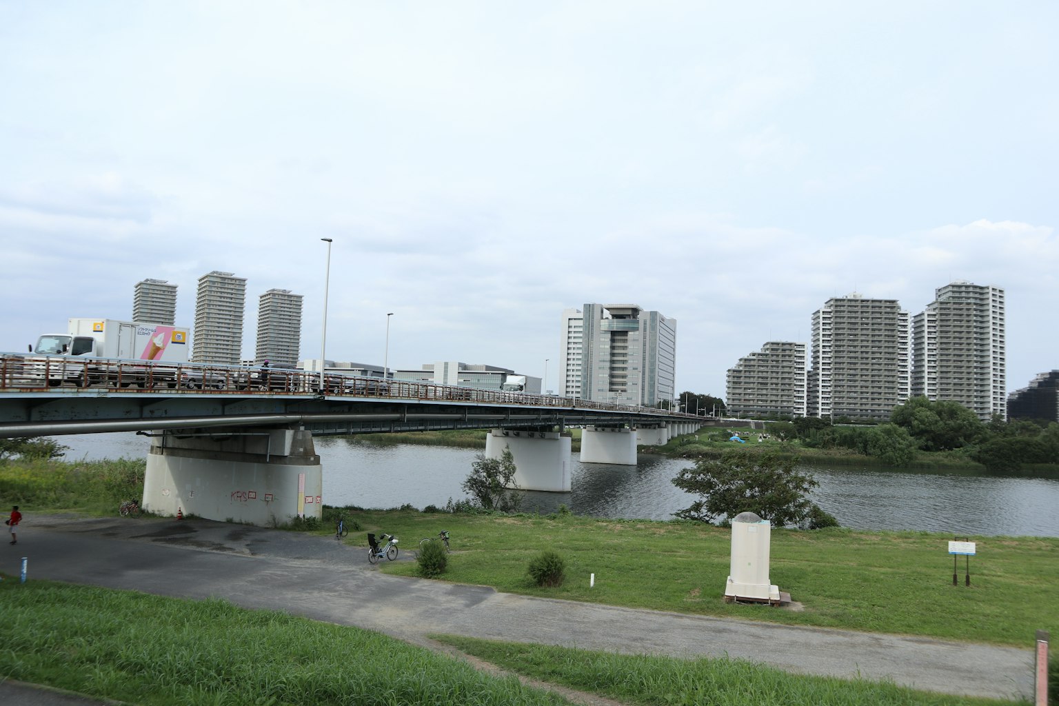 River view featuring a bridge and high-rise buildings