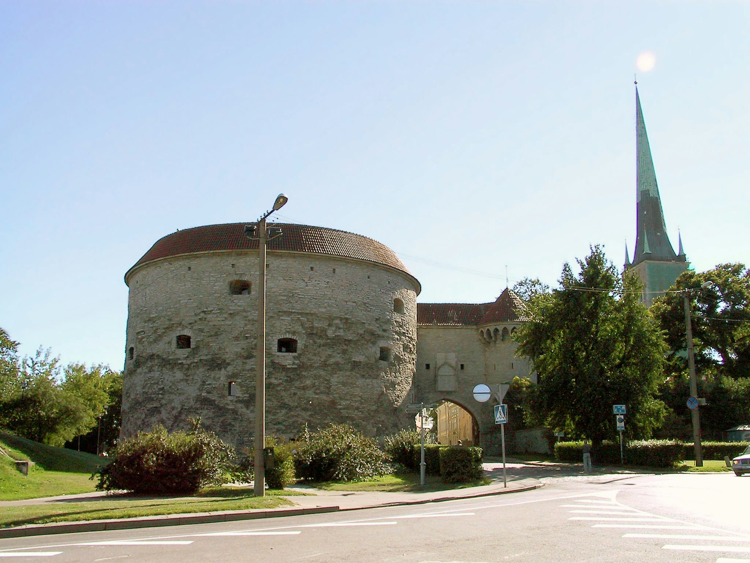 Stone tower with green trees in the background