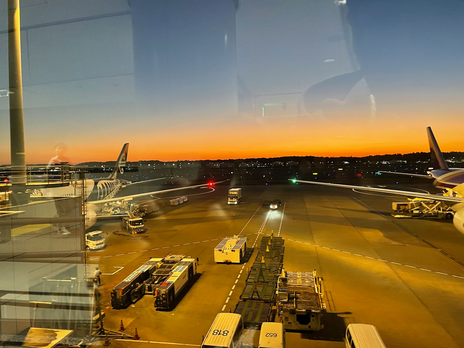 Airport sunset view with parked airplanes