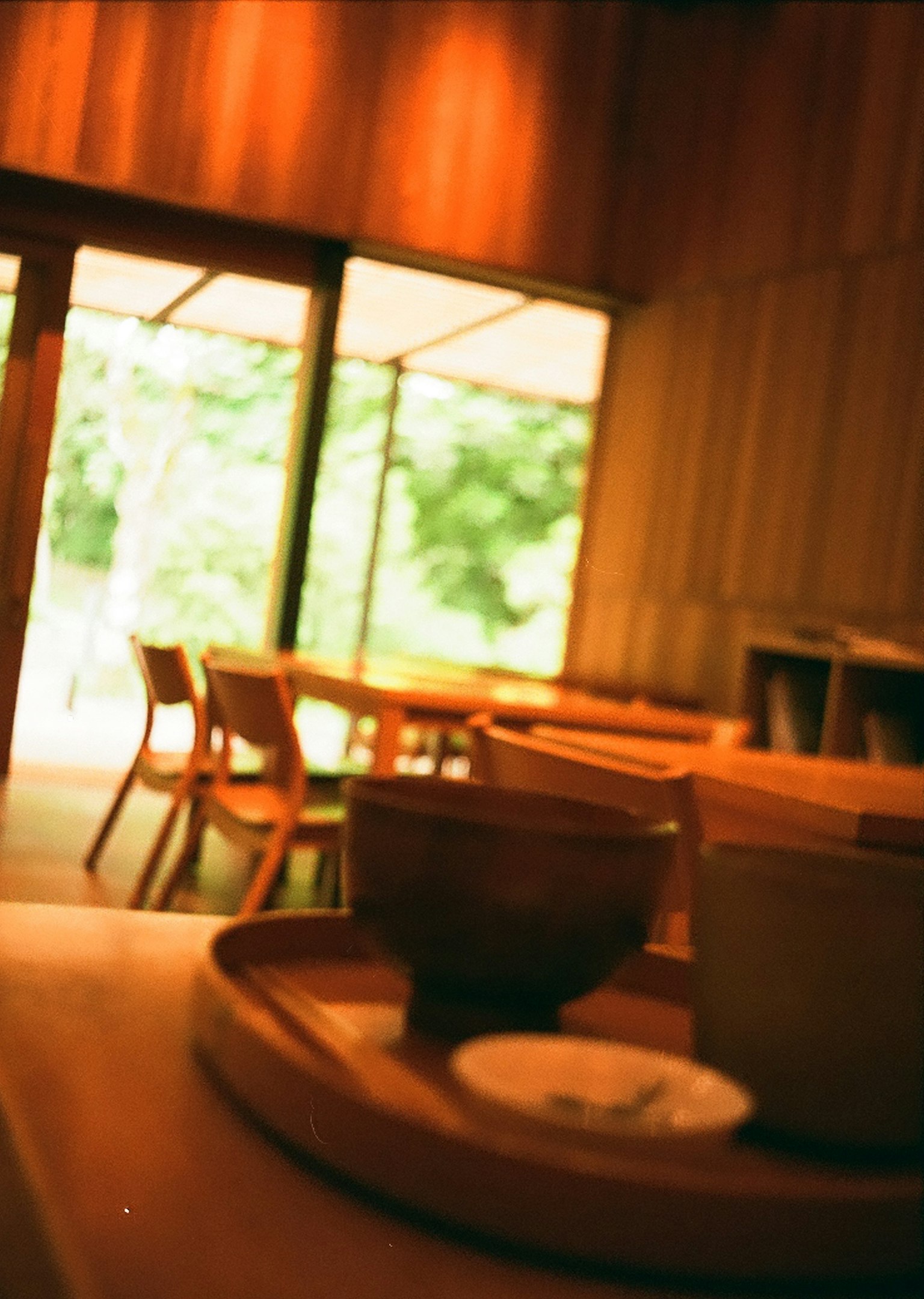 Serene cafe interior with wooden decor and natural light