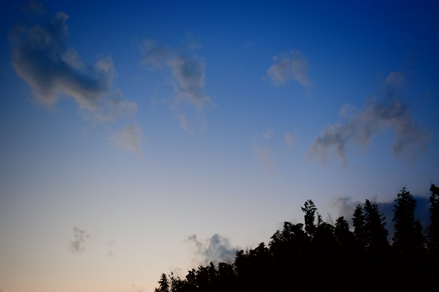 Landscape featuring a blue sky with clouds