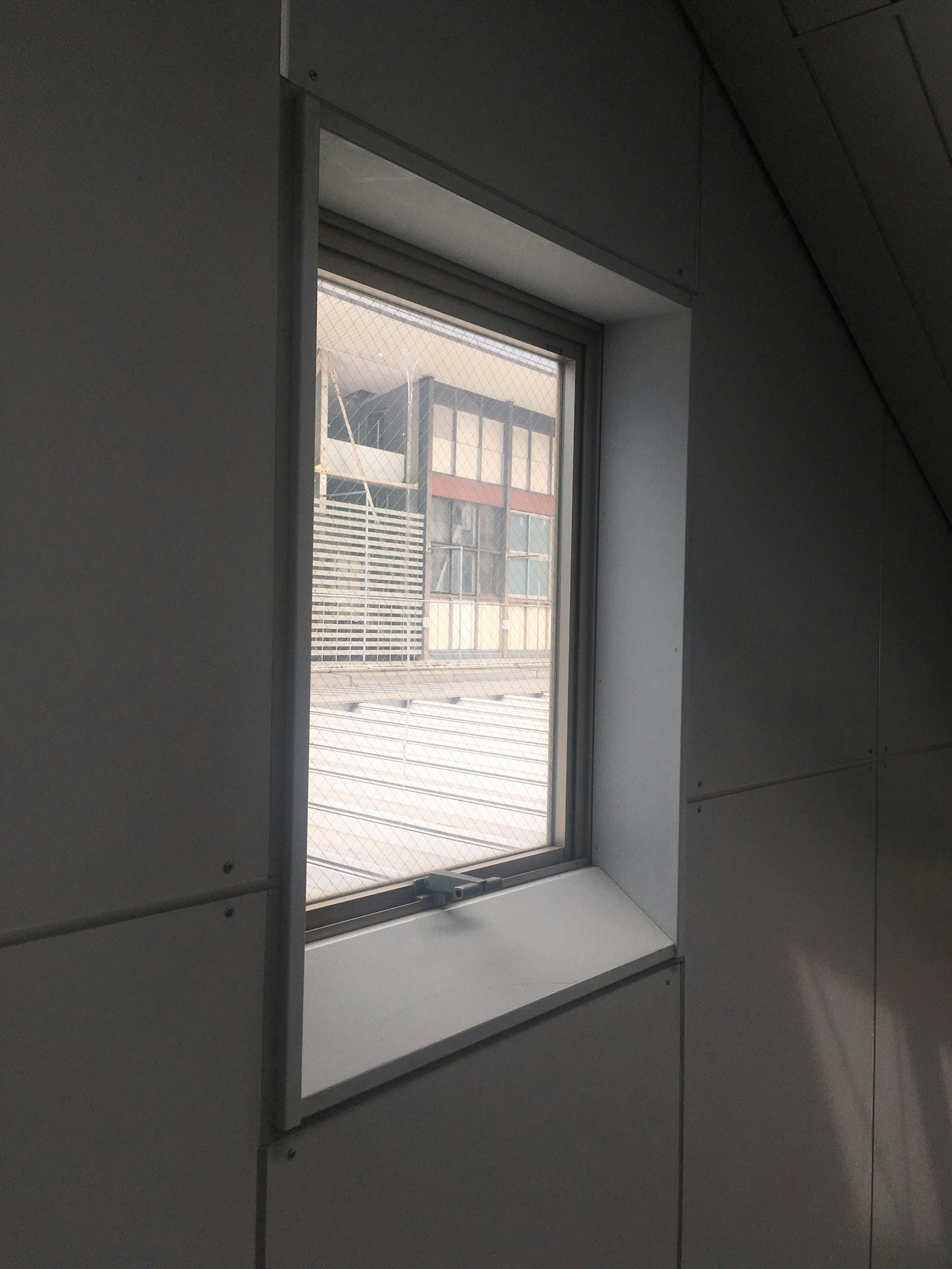 Interior window with natural light showing an exterior view
