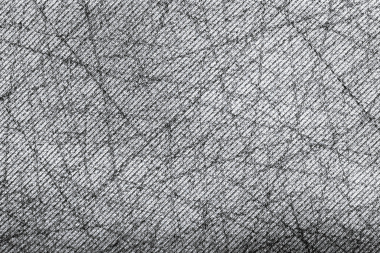 Close-up of gray fabric texture featuring intricate lines and patterns