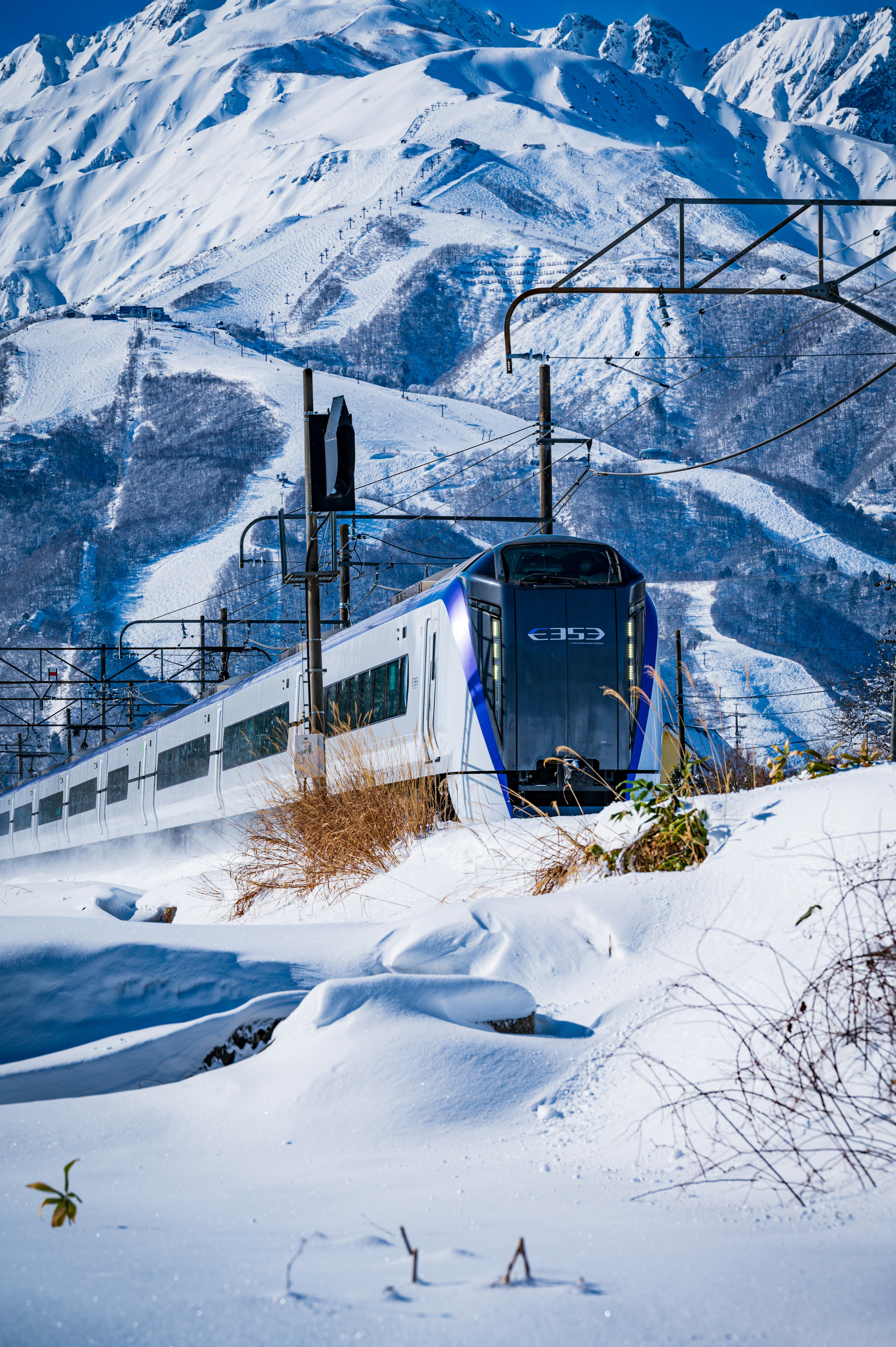 Express train running through snowy mountains
