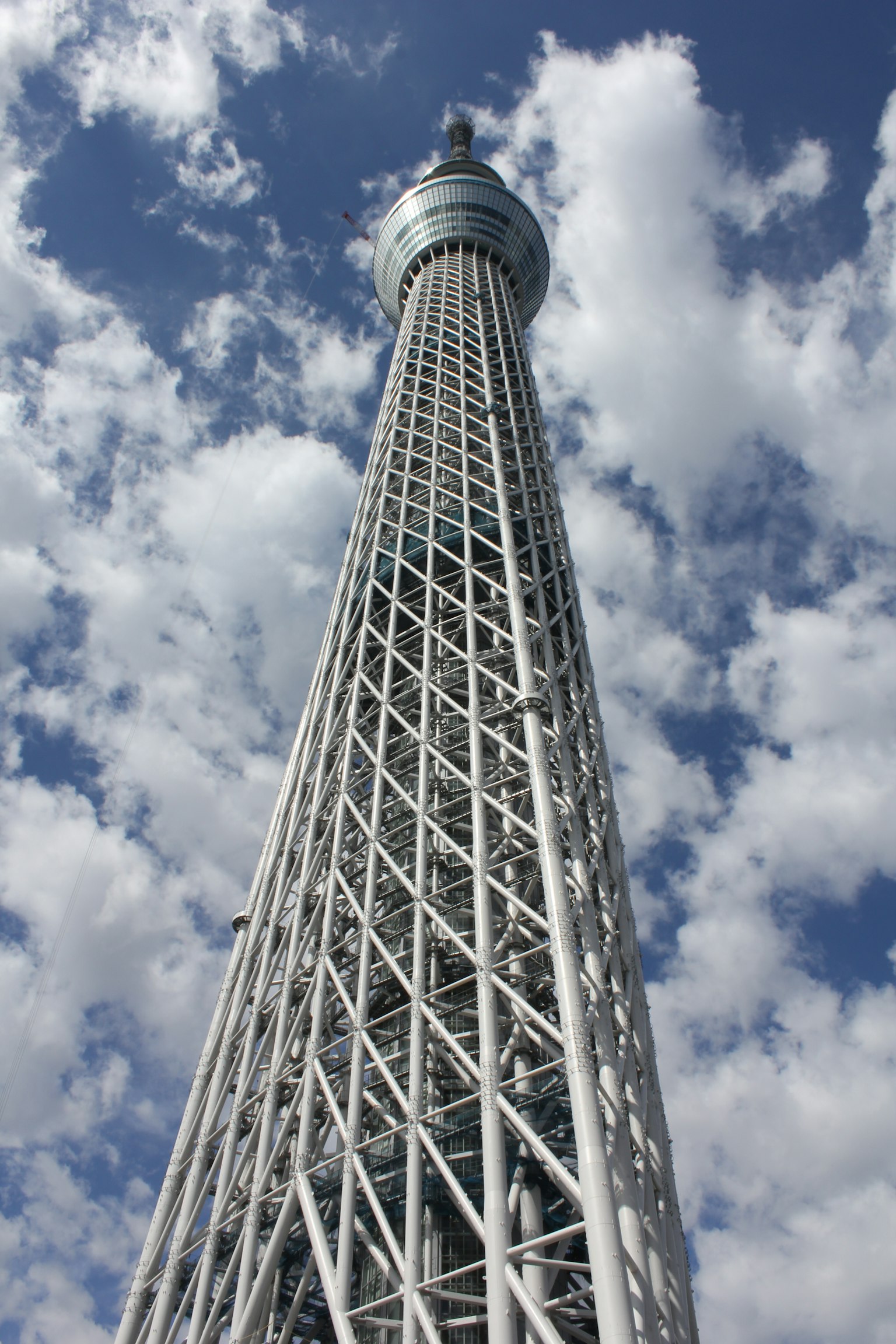 Tokyo Skytree viewed from below against a cloudy sky