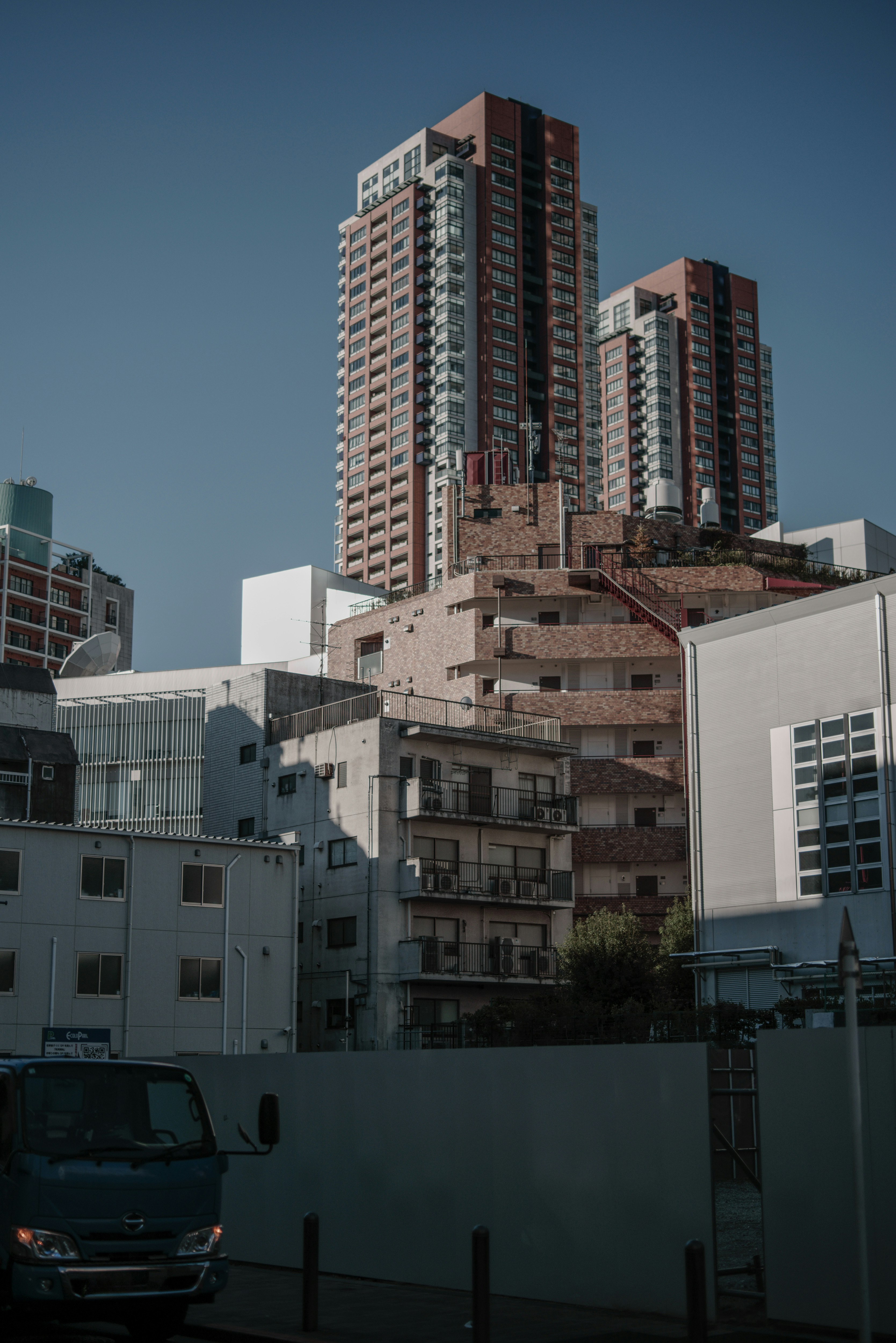 high-rise apartment buildings against a clear blue sky