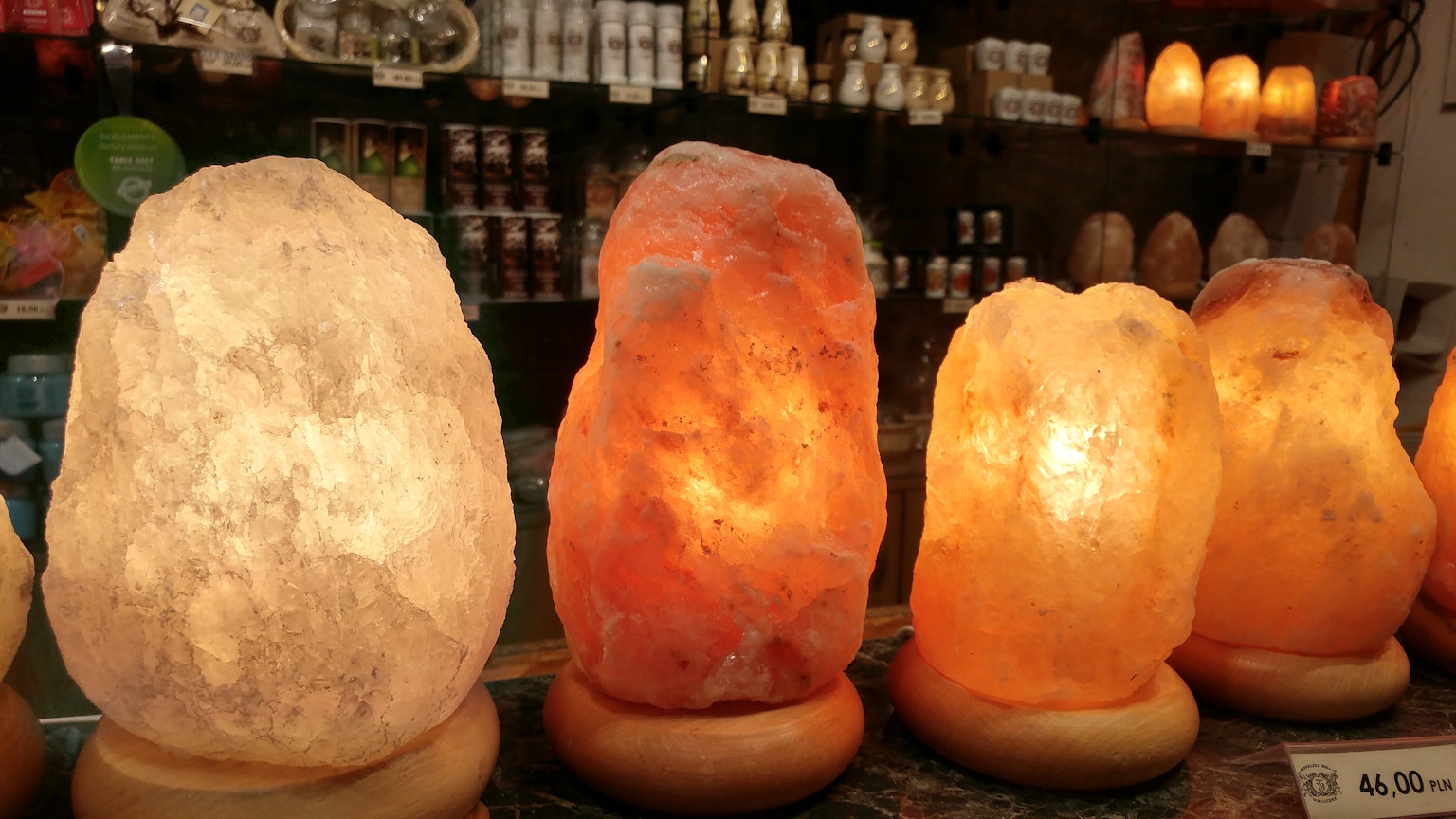 Glowing salt lamps displayed in warm colors