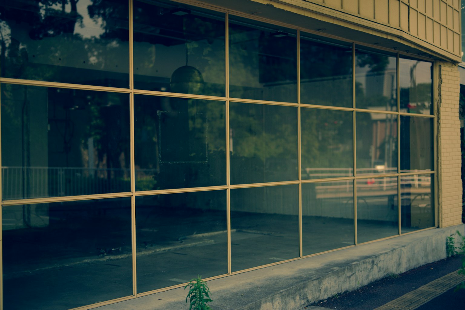 Image of a vacant storefront with large glass windows