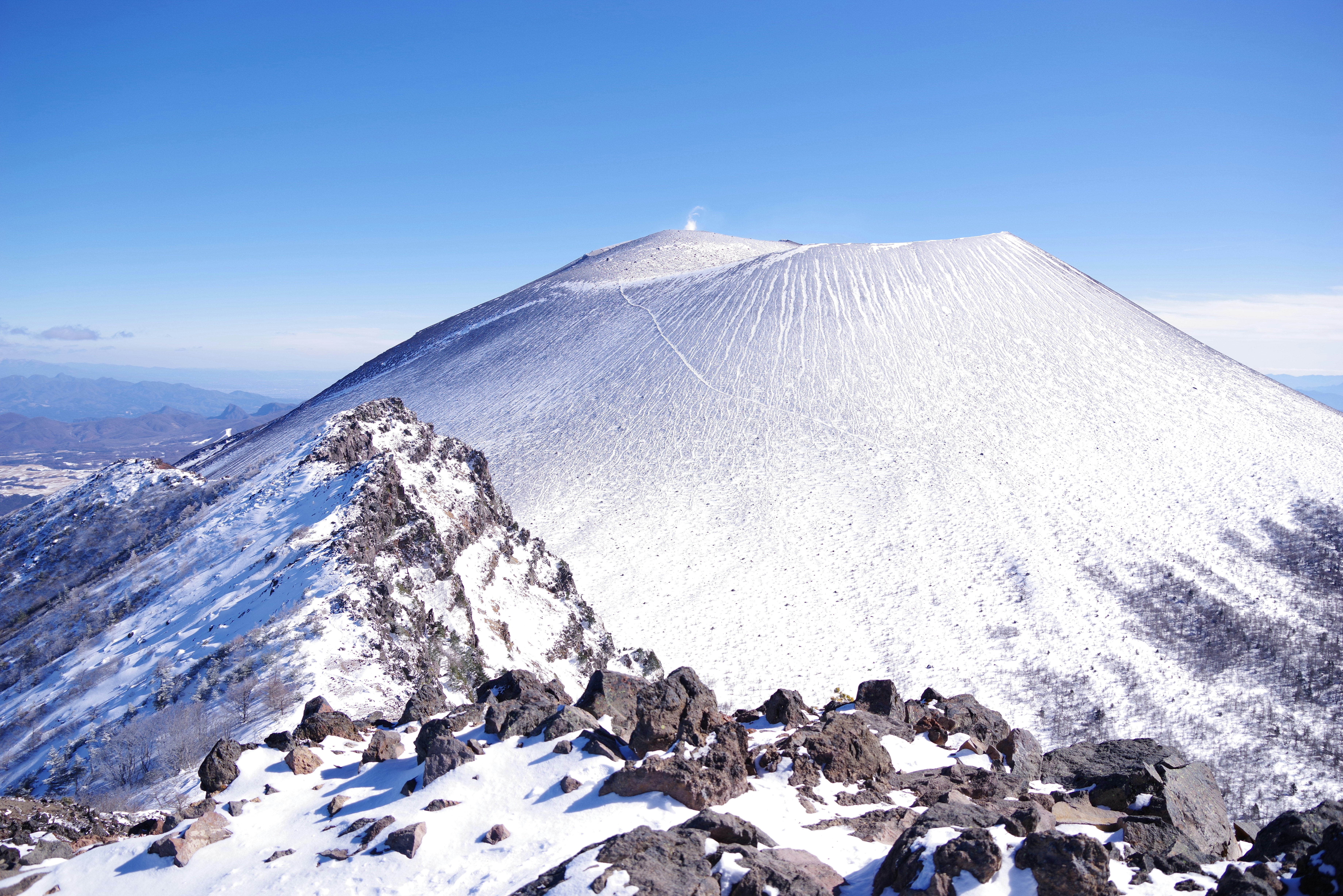 Snow-capped mountain with a clear blue sky