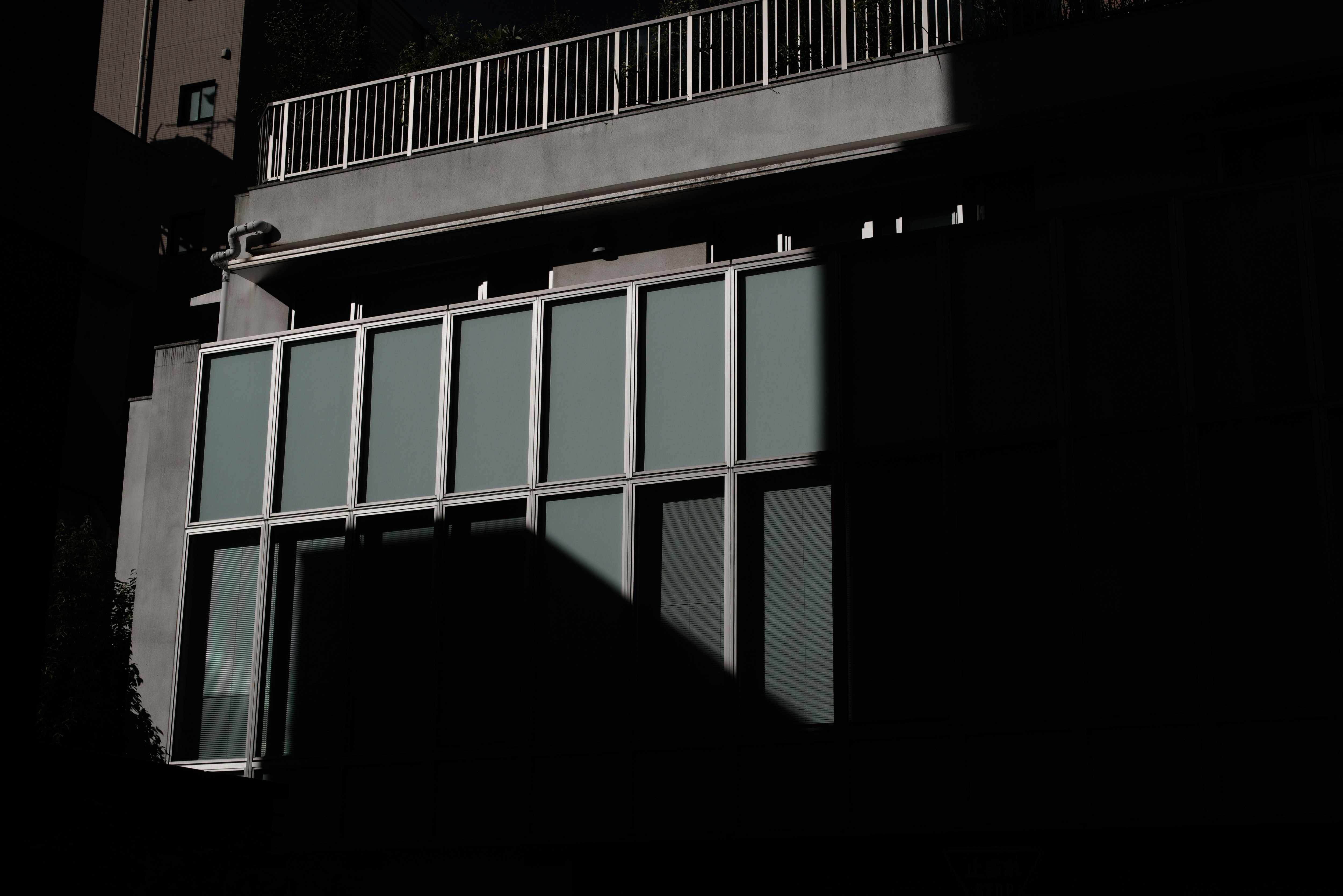 balcony of a building overlooking a cityscape at sunrise