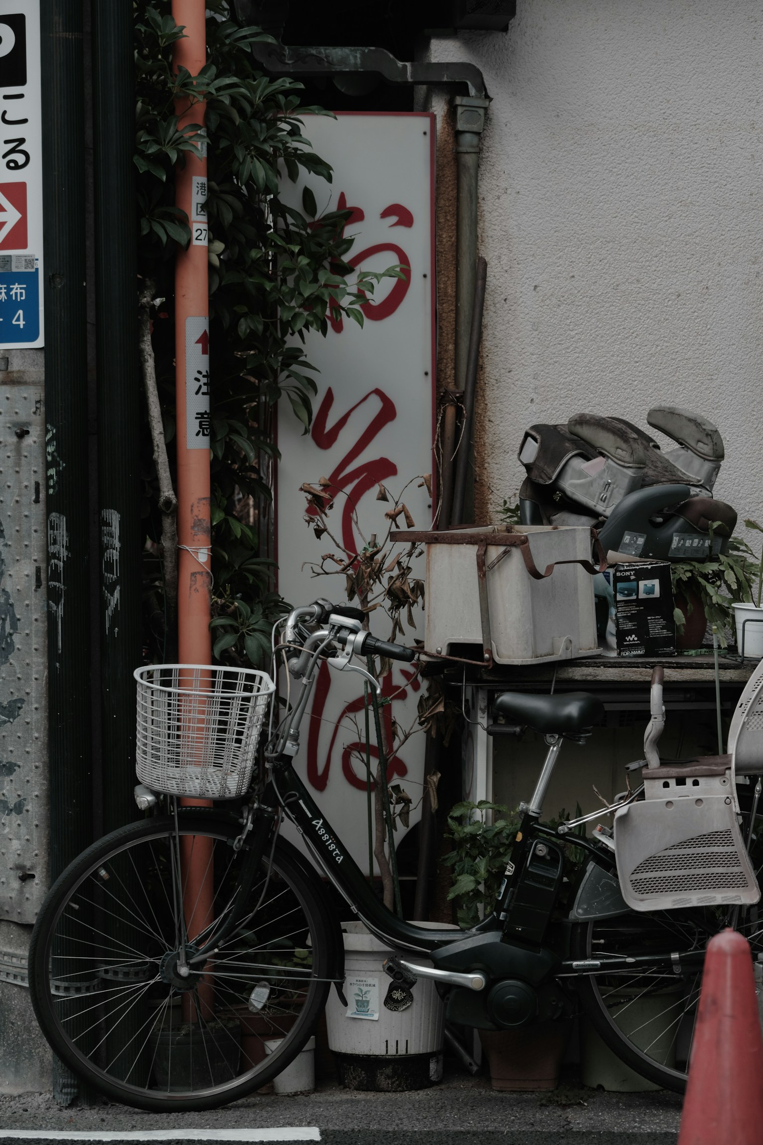 Urban scene featuring a bicycle and a sign