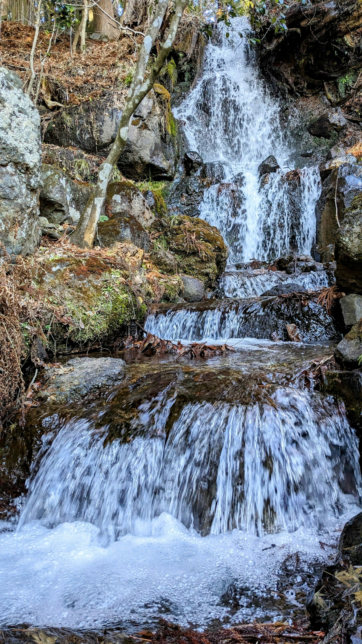 A beautiful waterfall cascading down rocky terrain