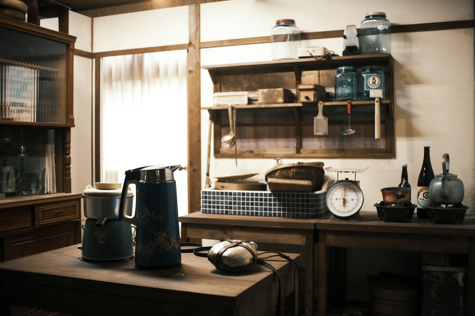 Vintage kitchen interior with wooden shelves blue electric kettle antique kitchenware