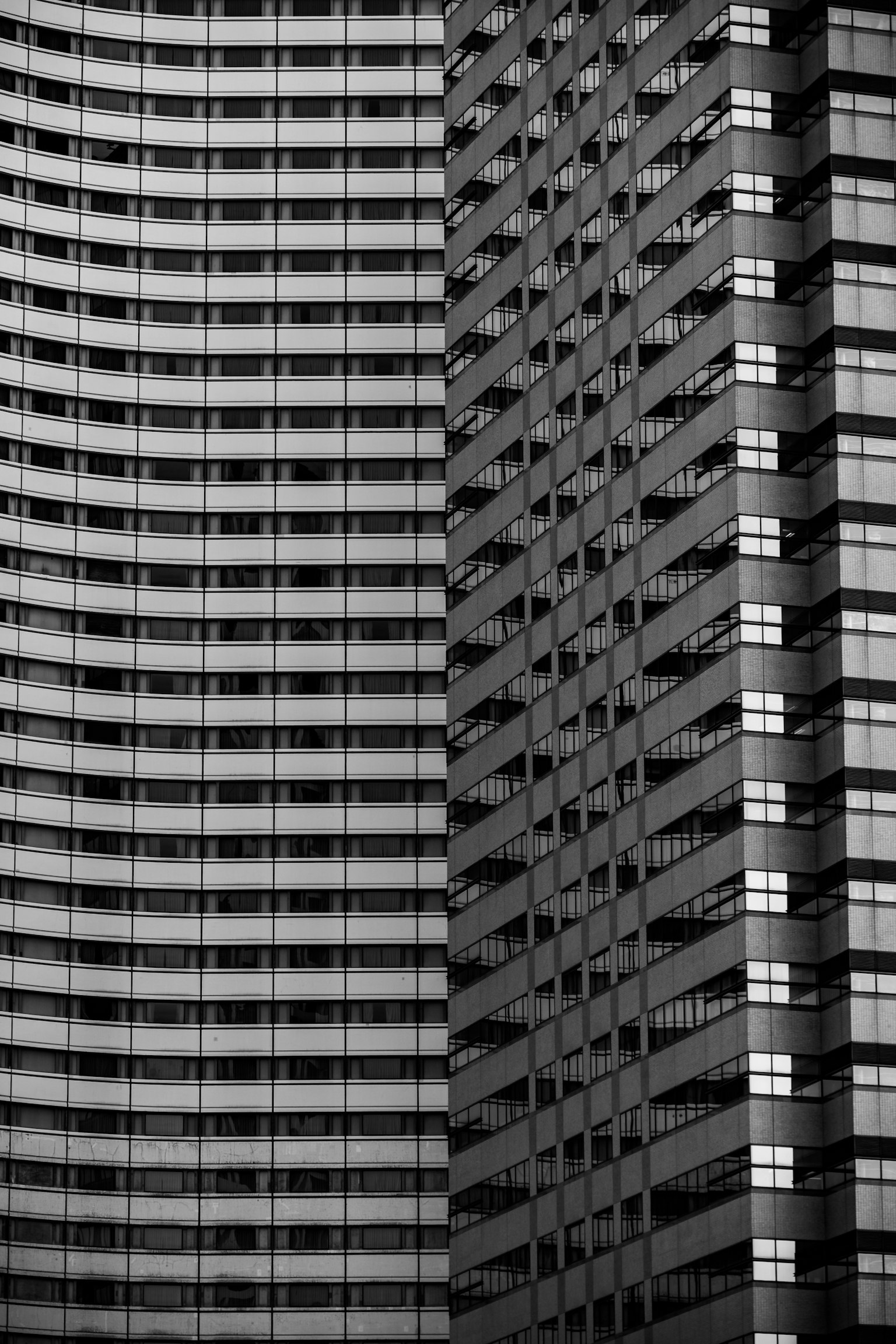 Modern skyscraper facade featuring striking black and white contrast