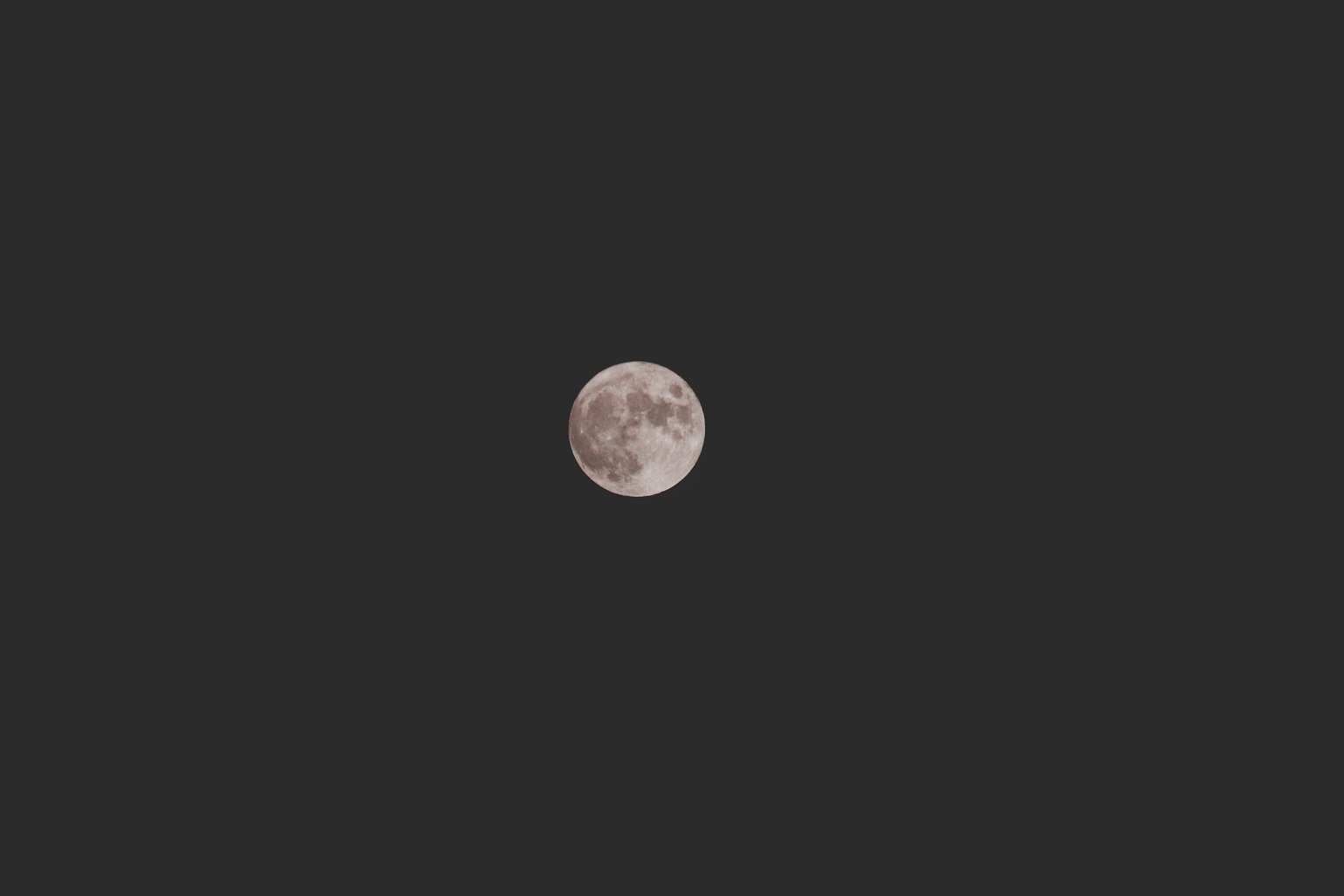 Bright full moon in the night sky