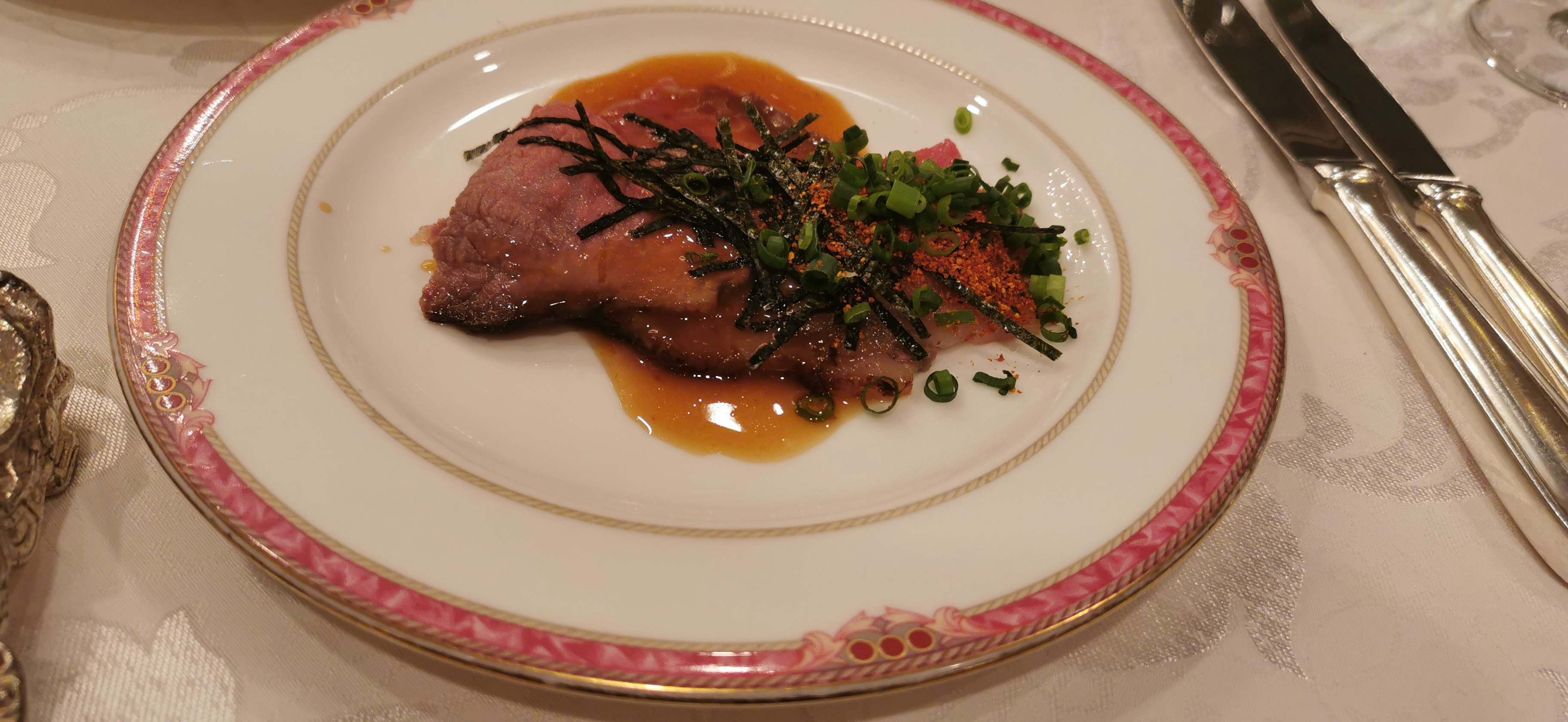 plated steak with sauce and garnish
