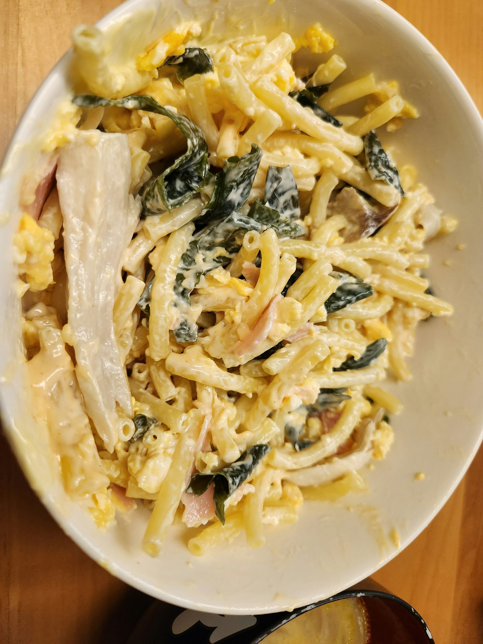 Creamy pasta salad with chicken in a bowl