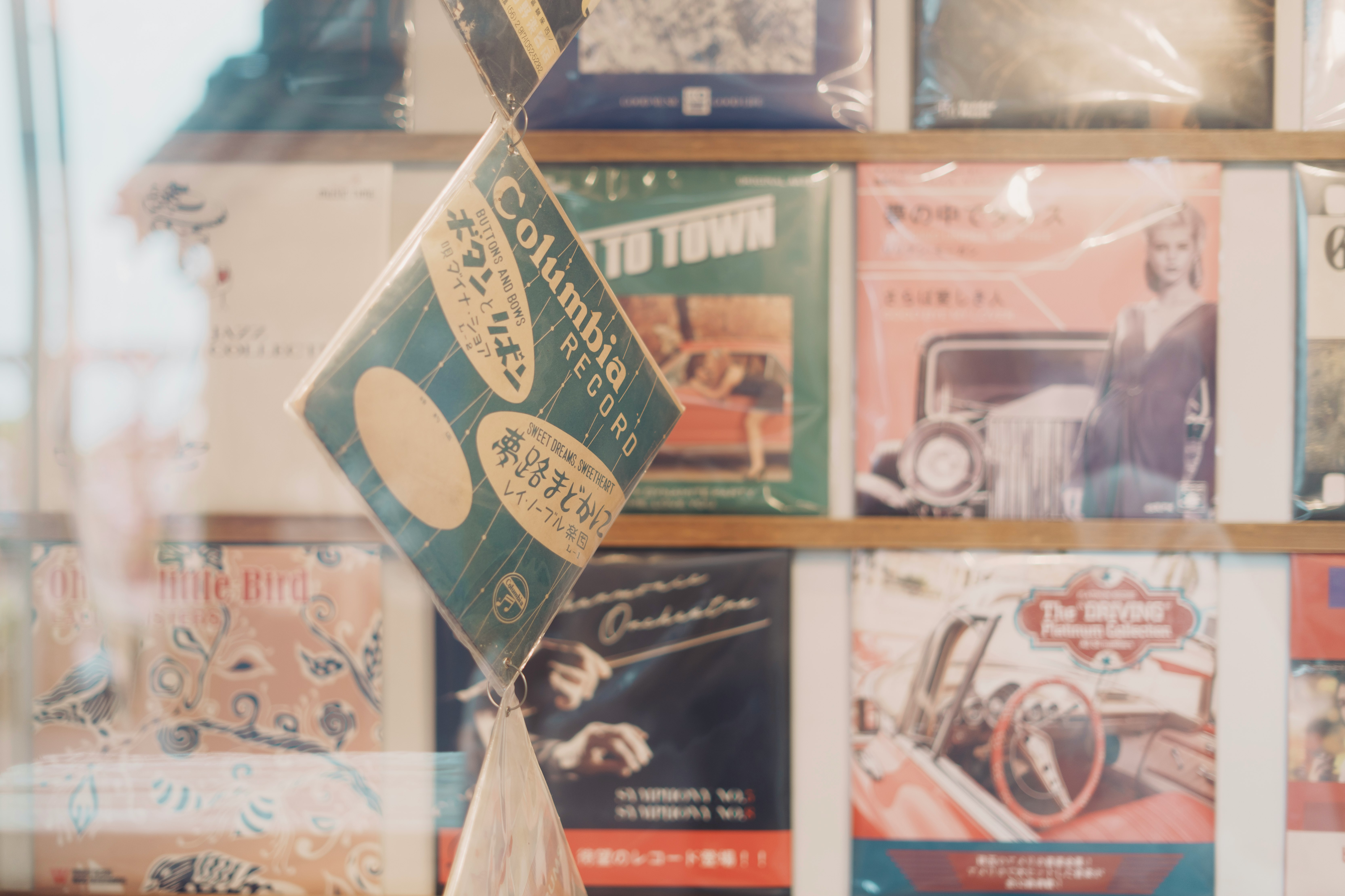 Shelf of retro camera magazines and postcards in a shop