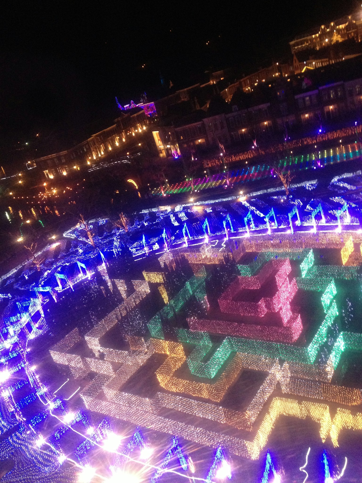 Colorful illuminated square at night with vibrant lights