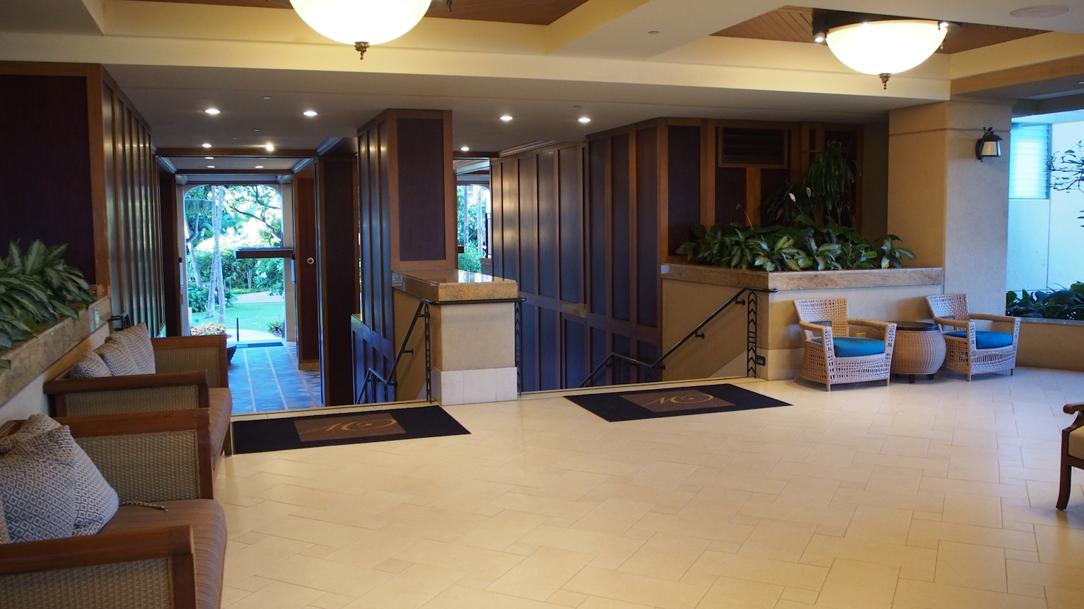 Bright interior of a lobby featuring green plants