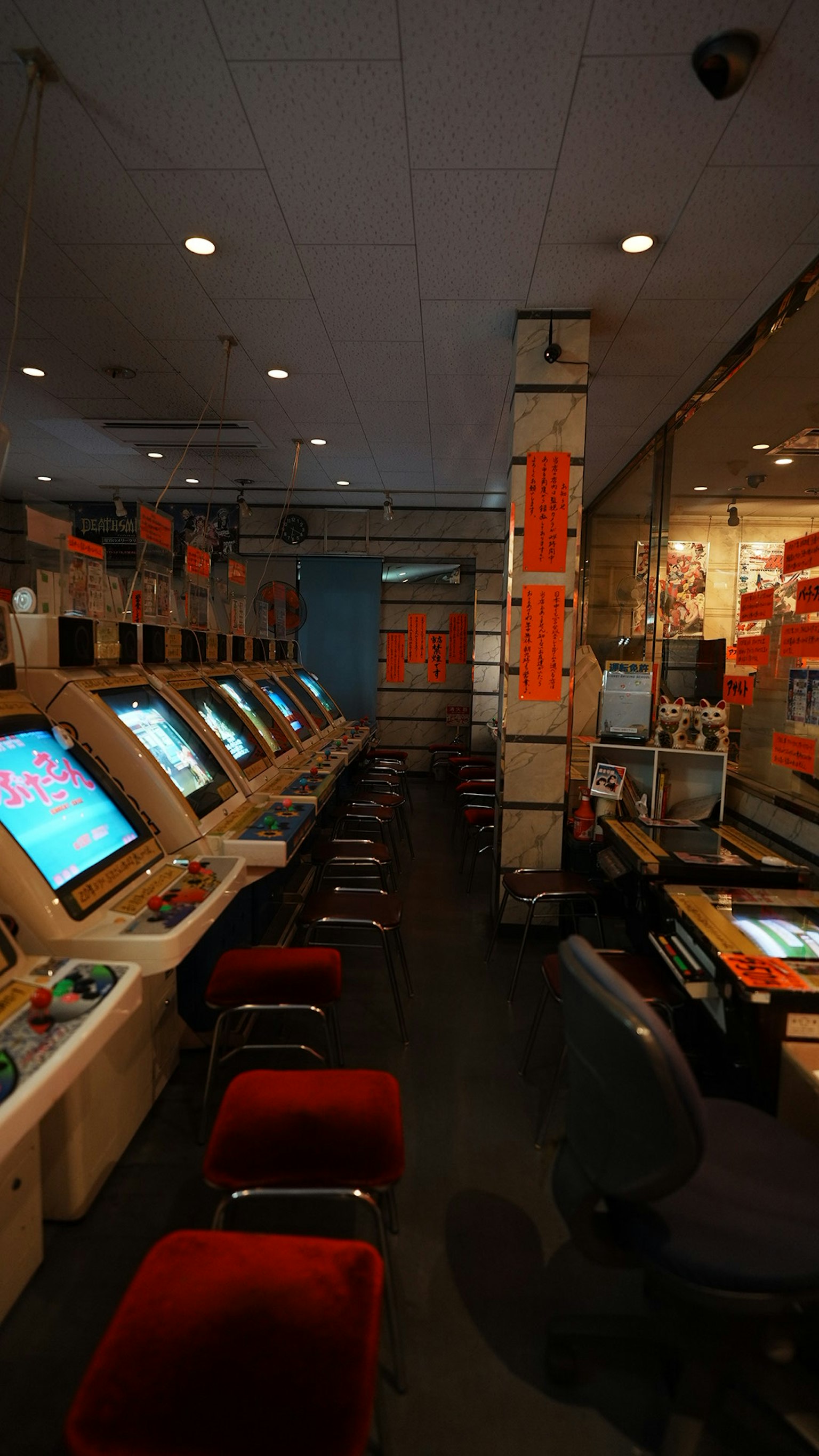 Interior of an arcade center featuring multiple arcade game machines