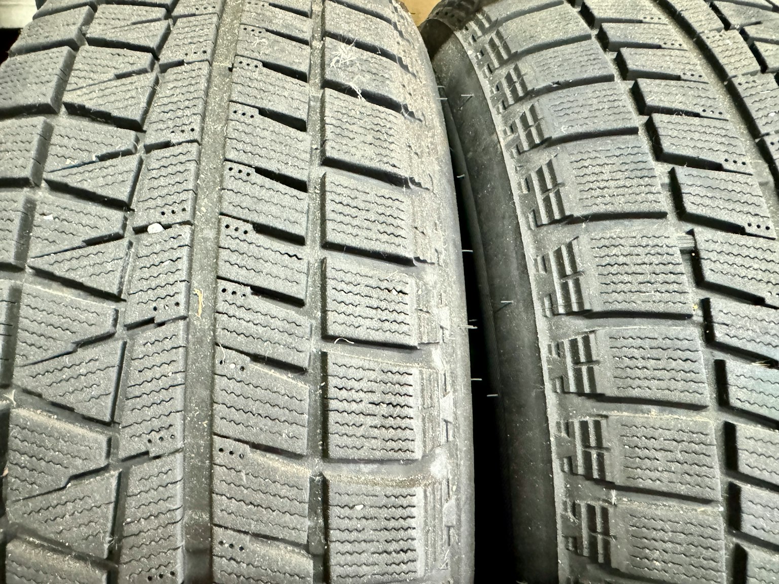 Image showing two tires with distinct tread patterns