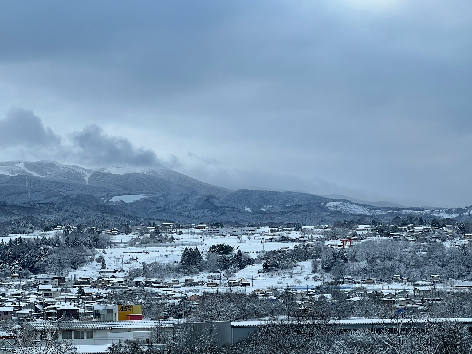 Snow-covered mountains and village landscape