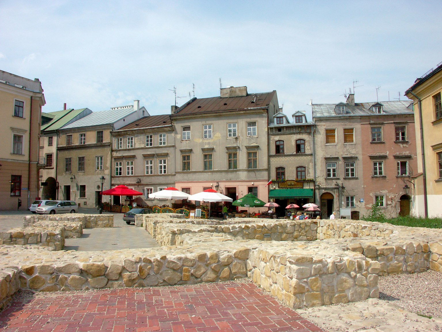 View of a square with ancient ruins and outdoor cafes