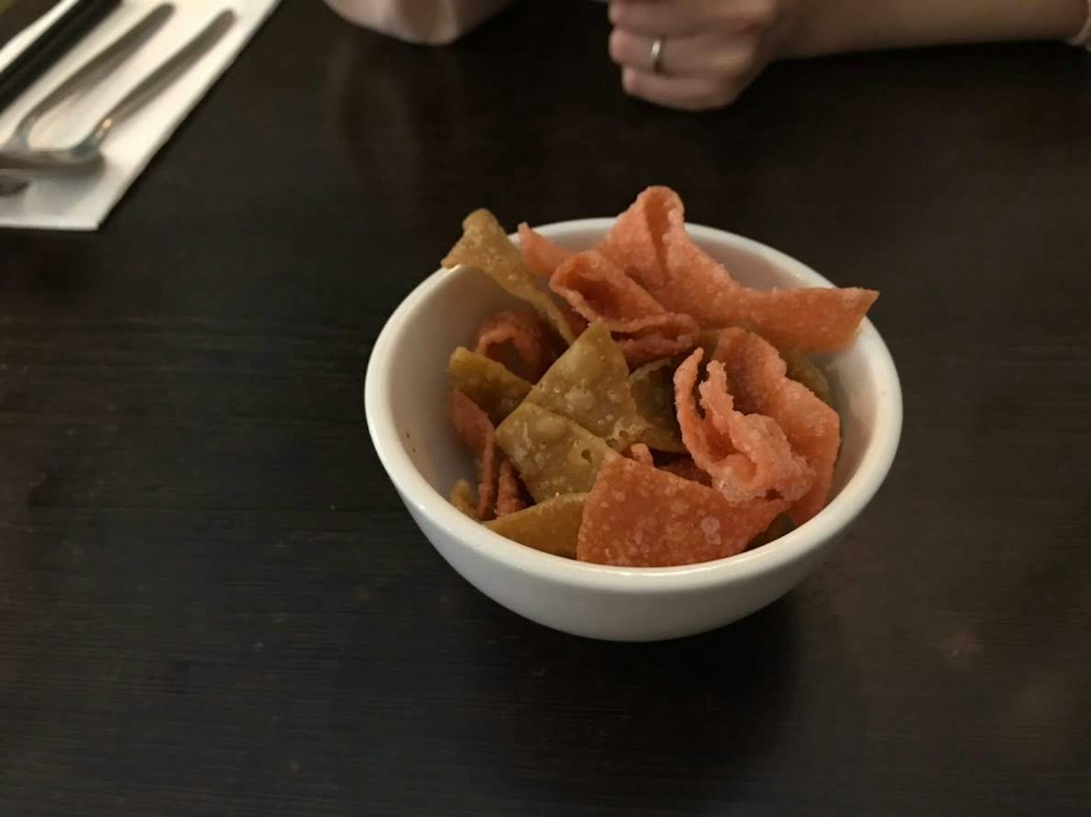 Colorful fried snacks in a white bowl