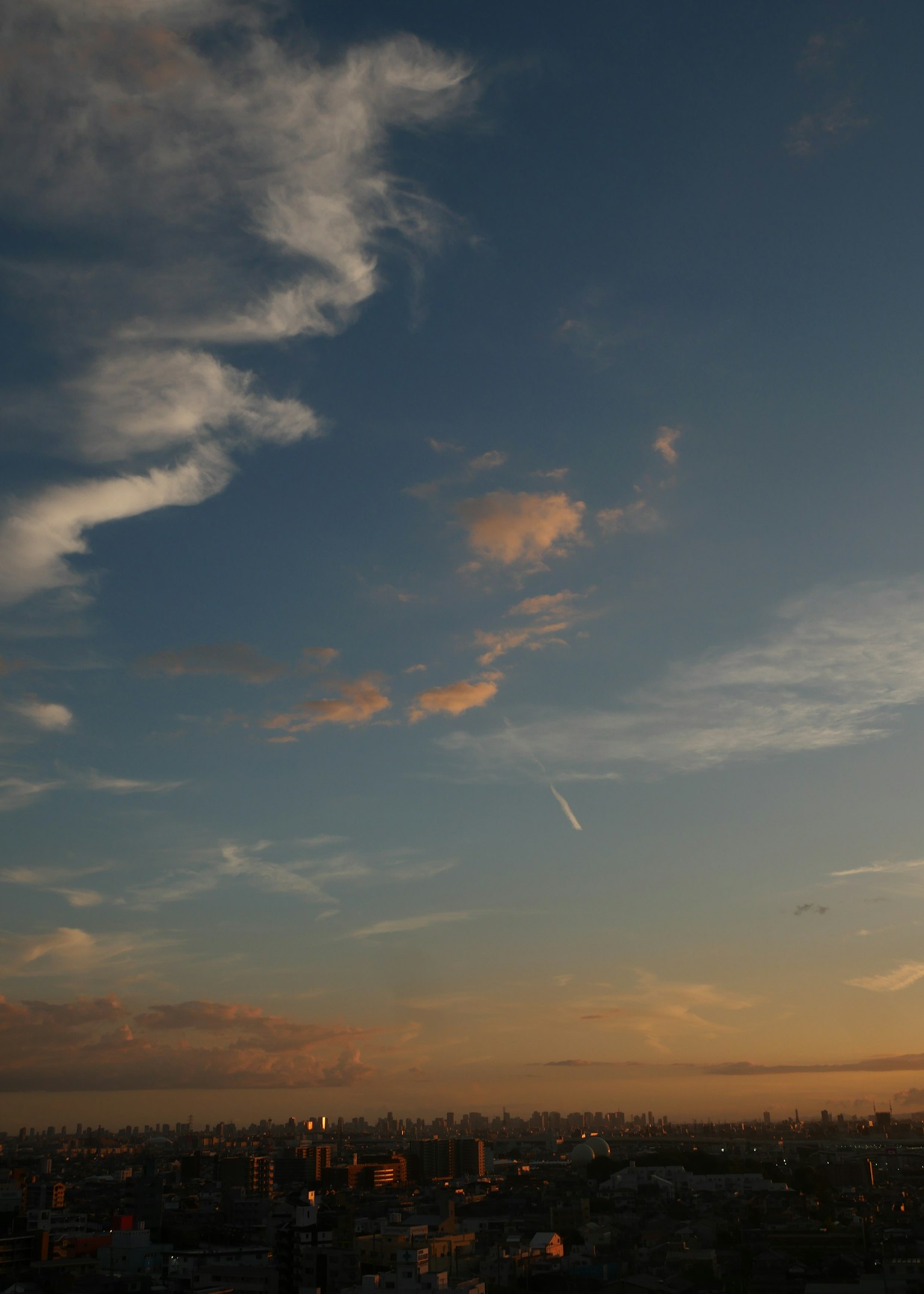 Beautiful sunset sky with scattered clouds