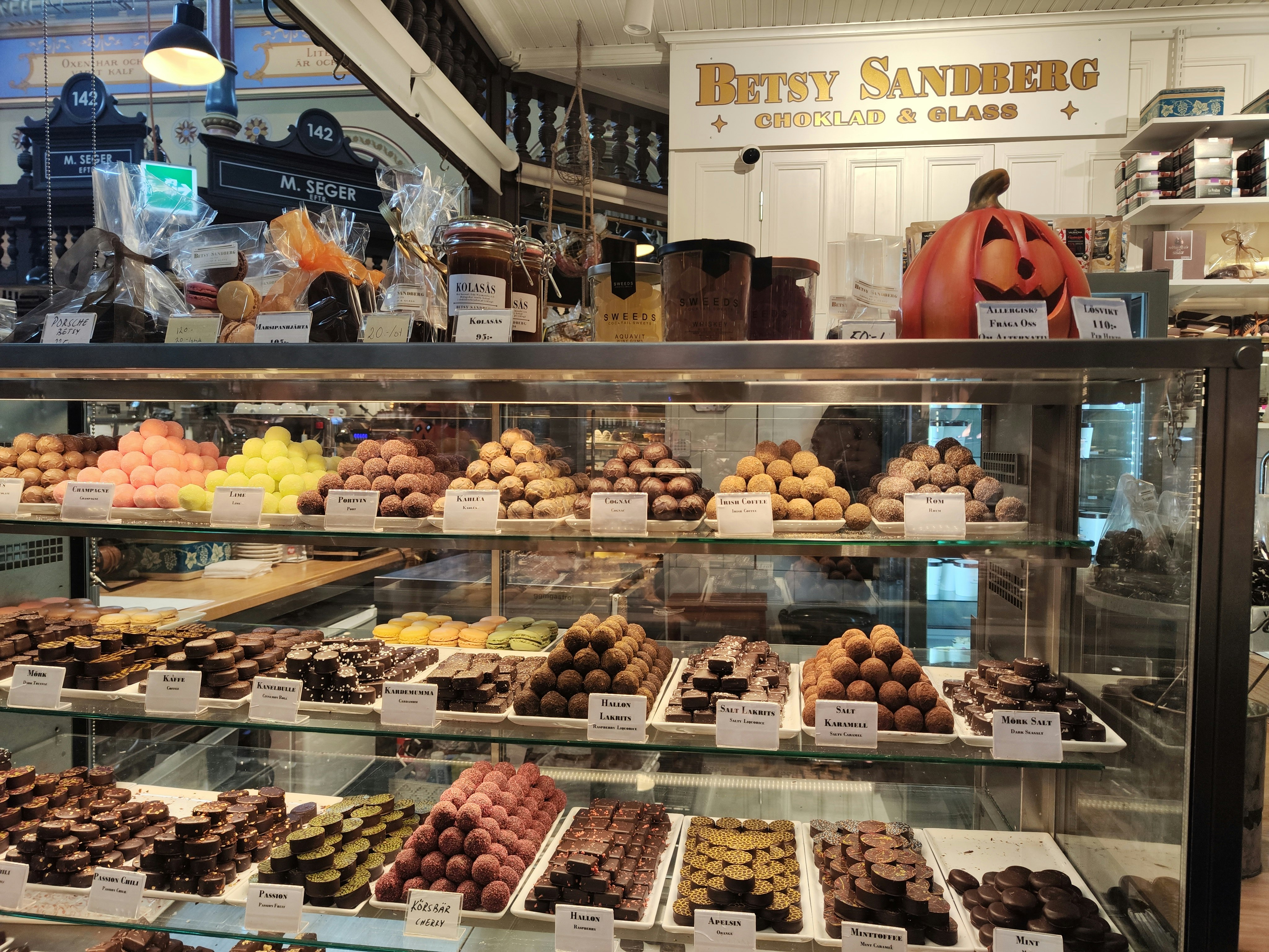 indoor display case with assorted pastries and chocolates